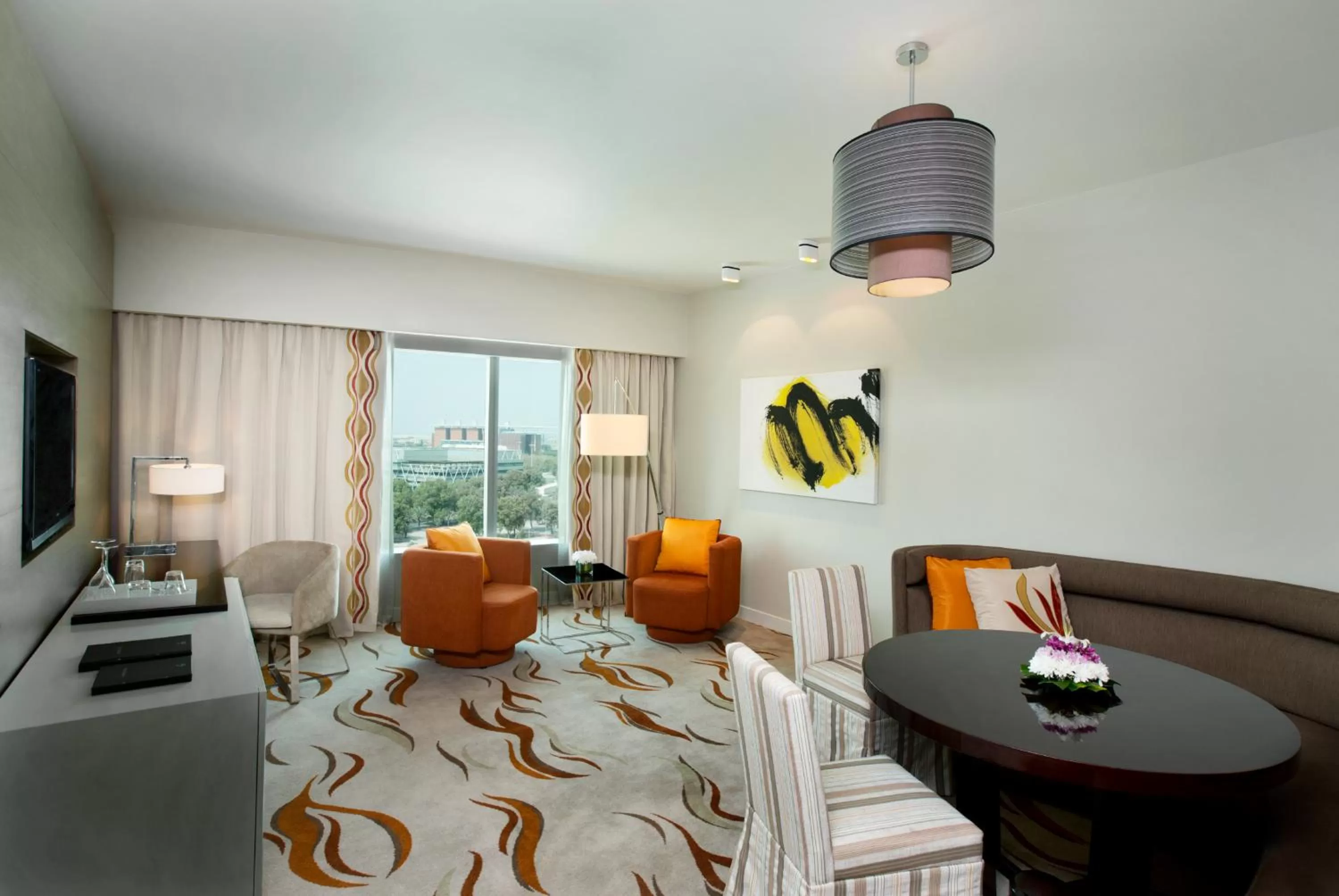 Seating area, Bed in Millennium Al Rawdah Hotel