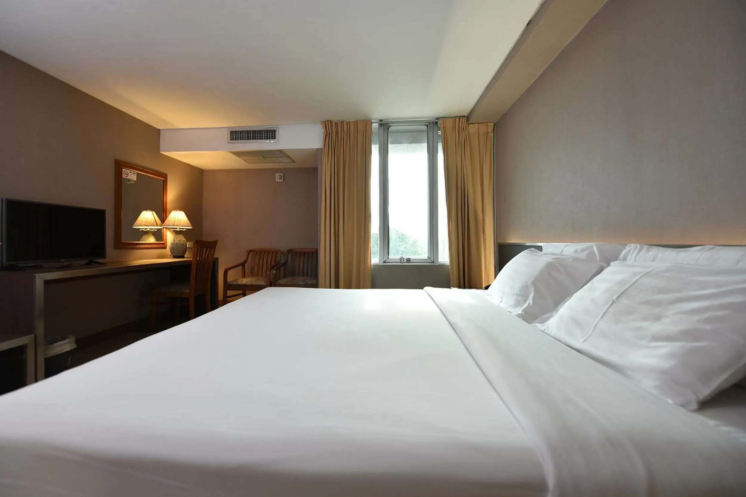 Bed in Bangkok City Suite