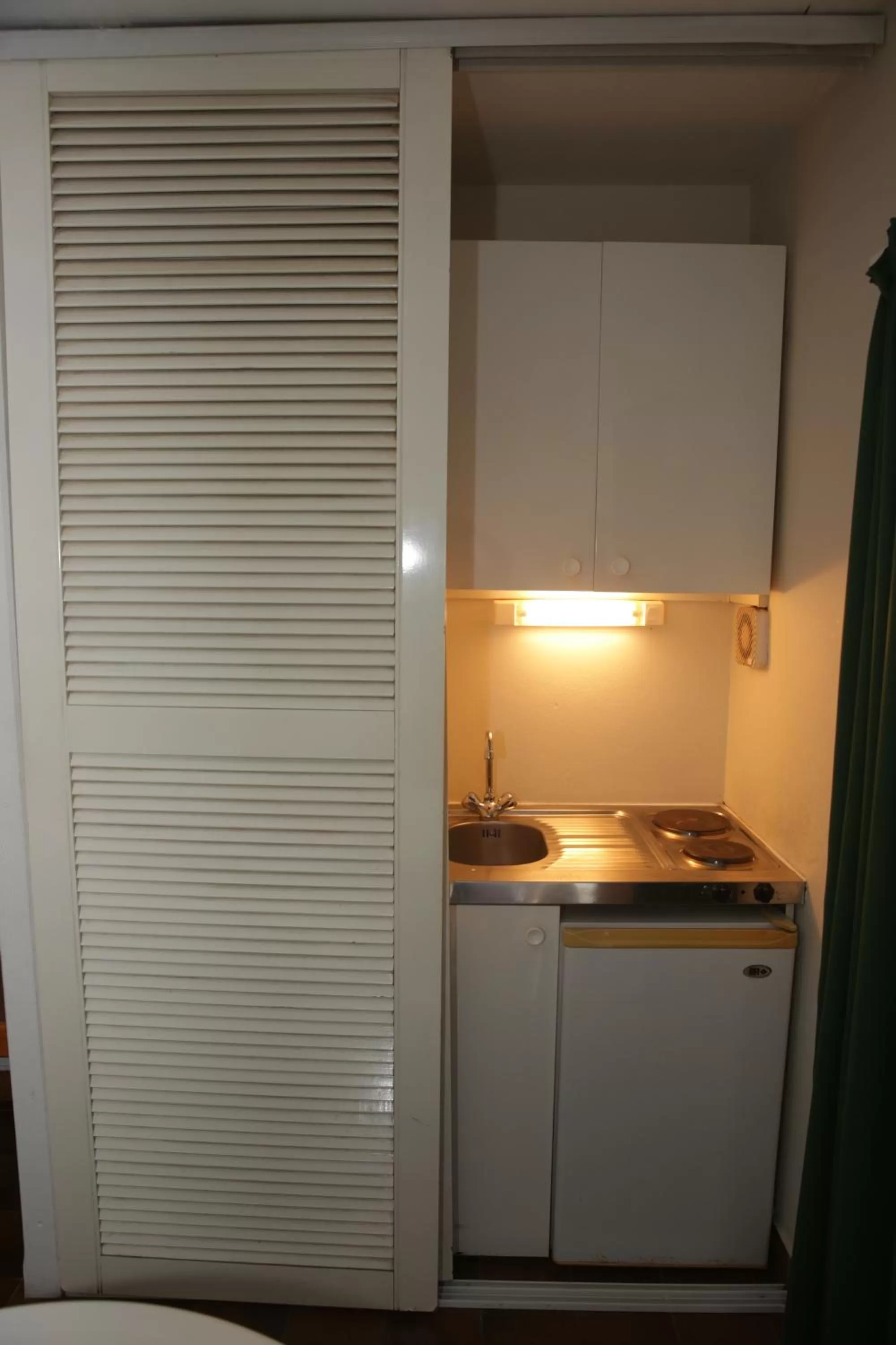 Bedroom, Kitchen/Kitchenette in Hotel Village Soleil