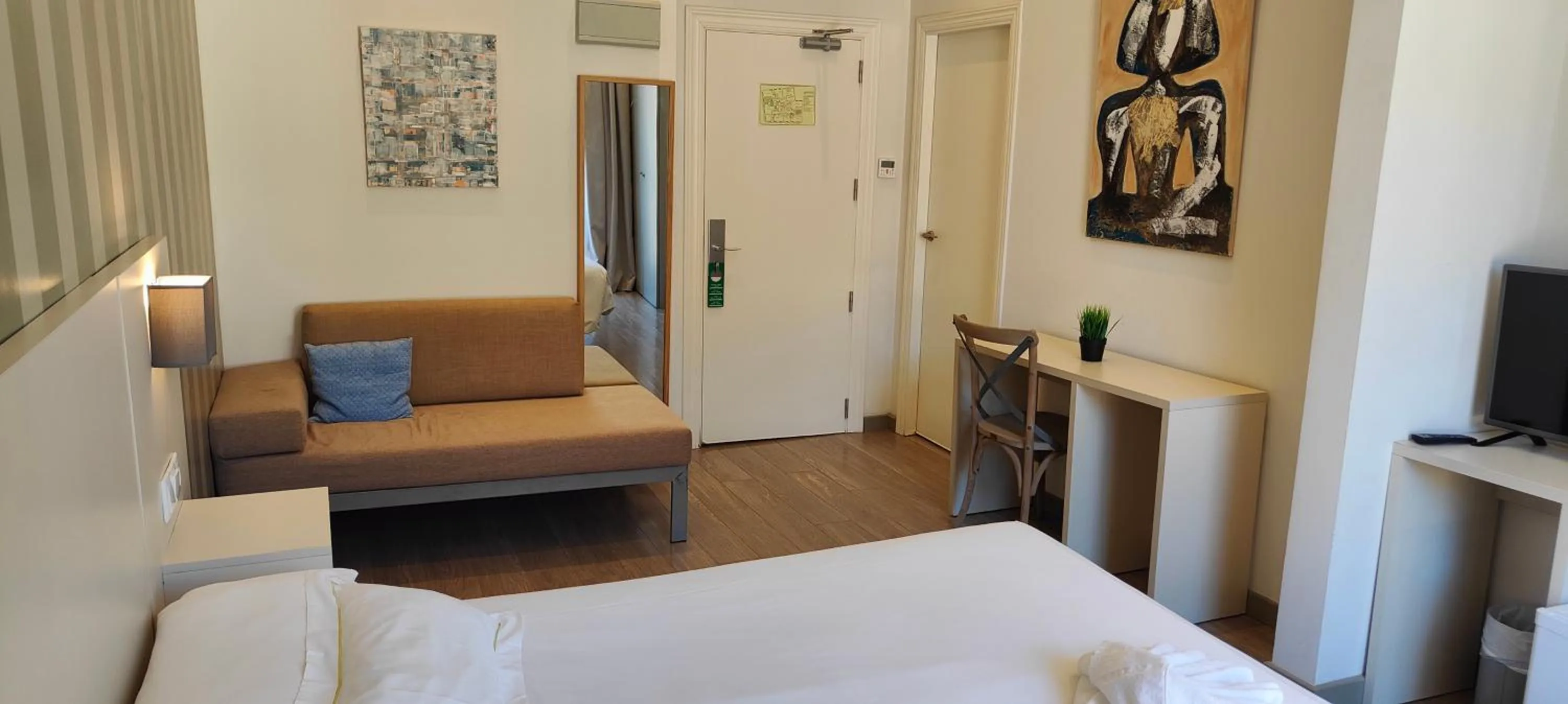 Bed in Hotel San Lorenzo Boutique Plaza