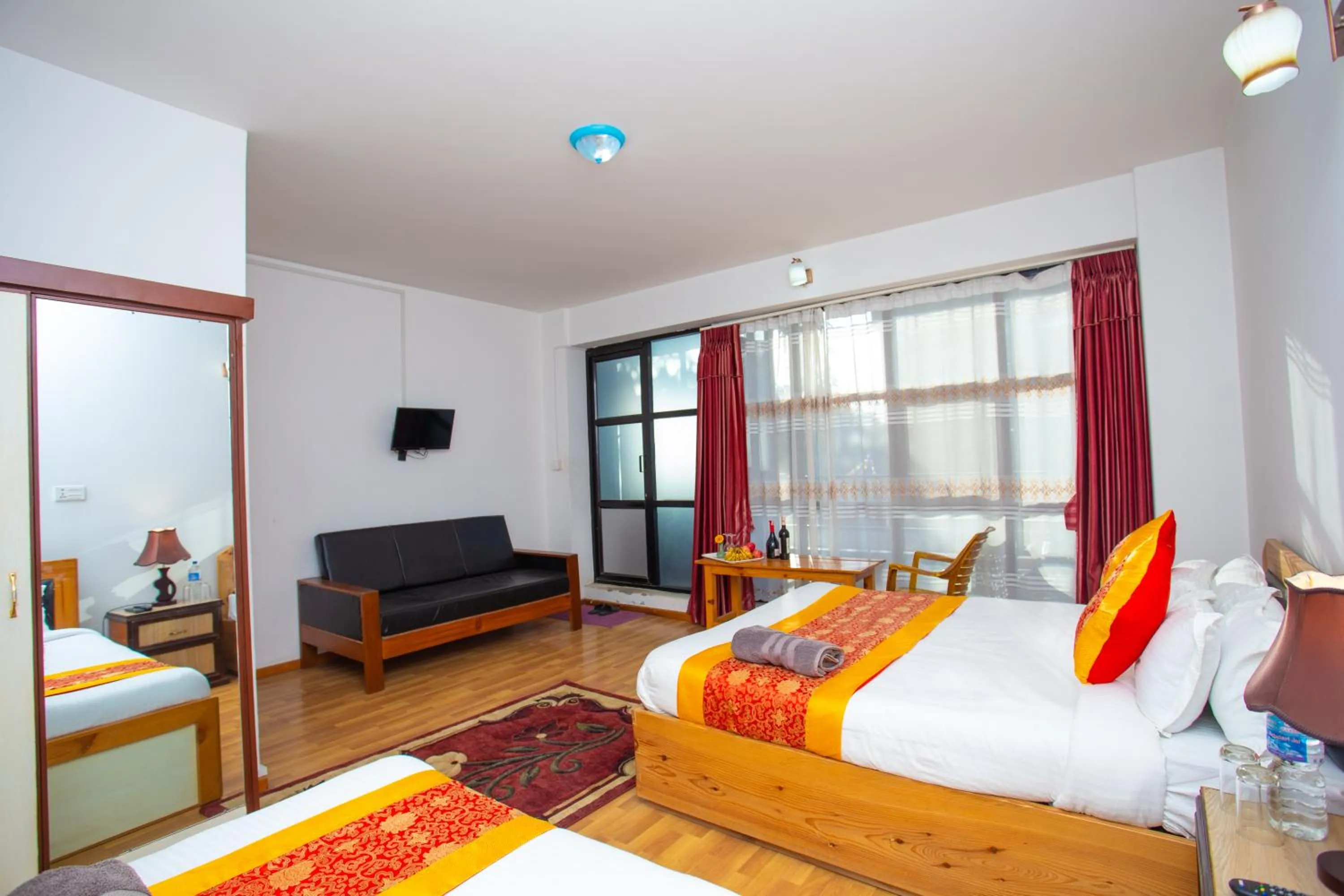 Photo of the whole room, Bed in The Boudha Inn