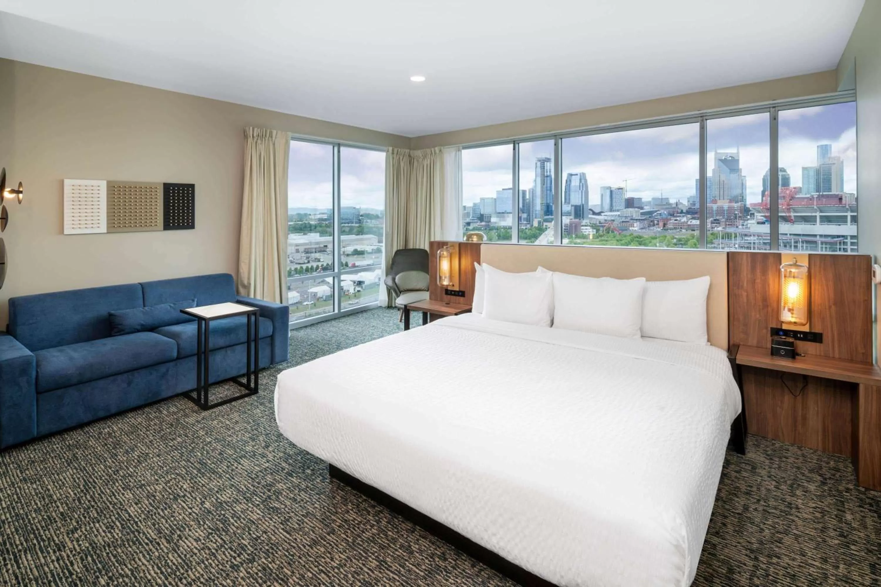 Photo of the whole room, Bed in La Quinta Inn & Suites by Wyndham Nashville Downtown Stadium
