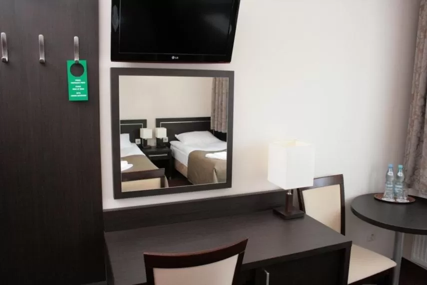 Seating area, Bed in Hotel Martex