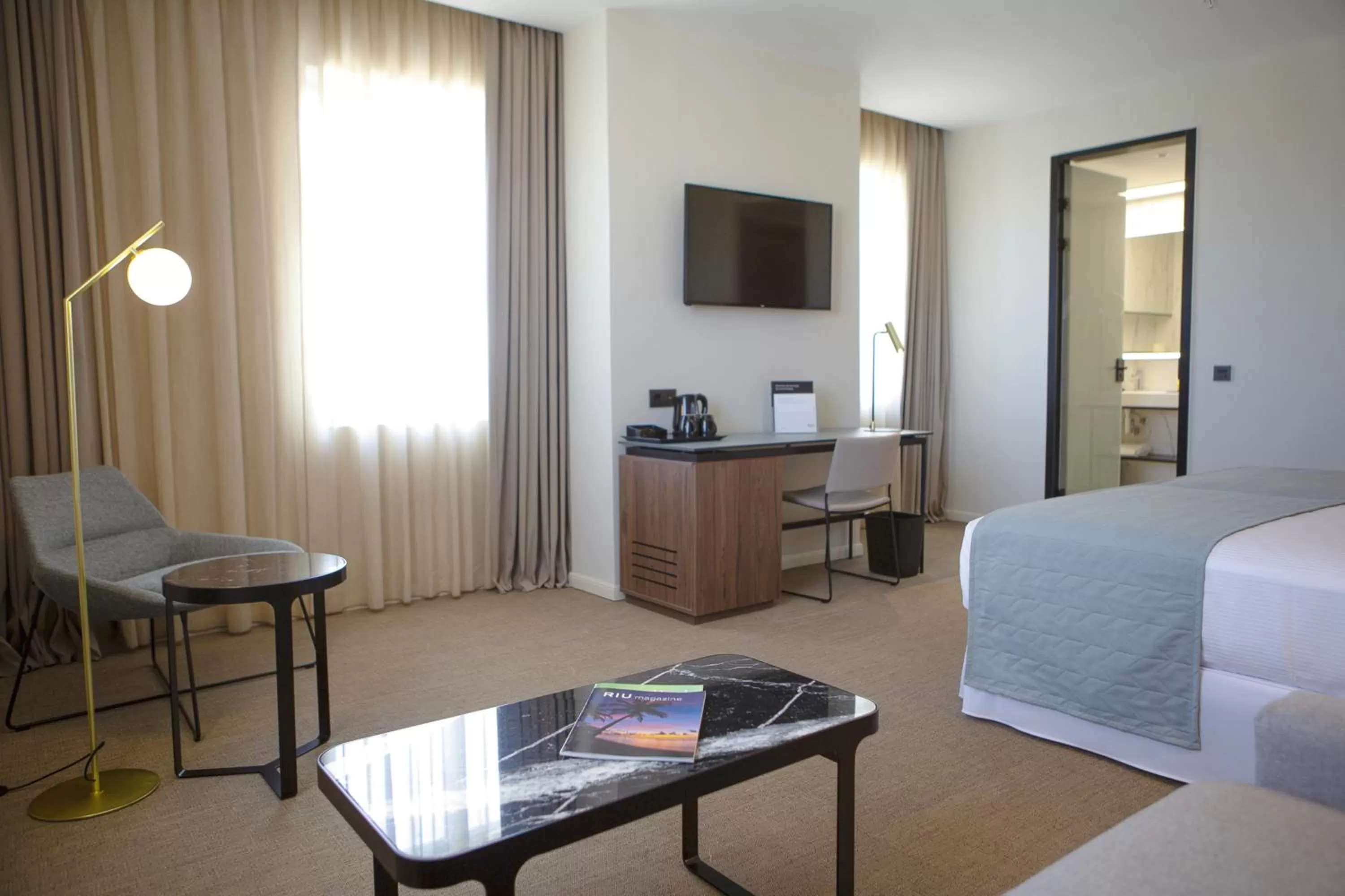 Seating area, Bed in Riu Plaza España