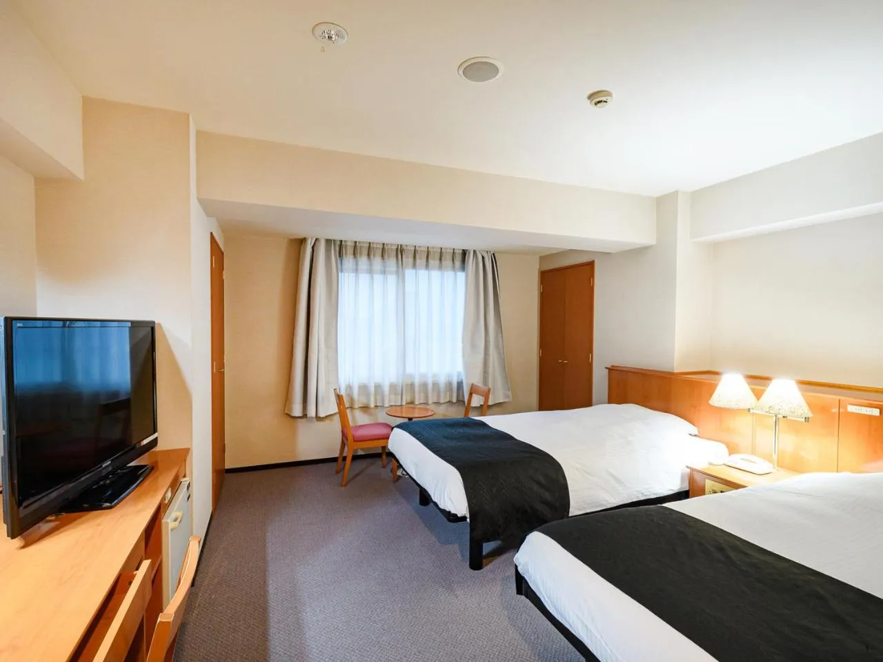 Photo of the whole room, Bed in APA Hotel Sapporo Odori Ekimae Minami