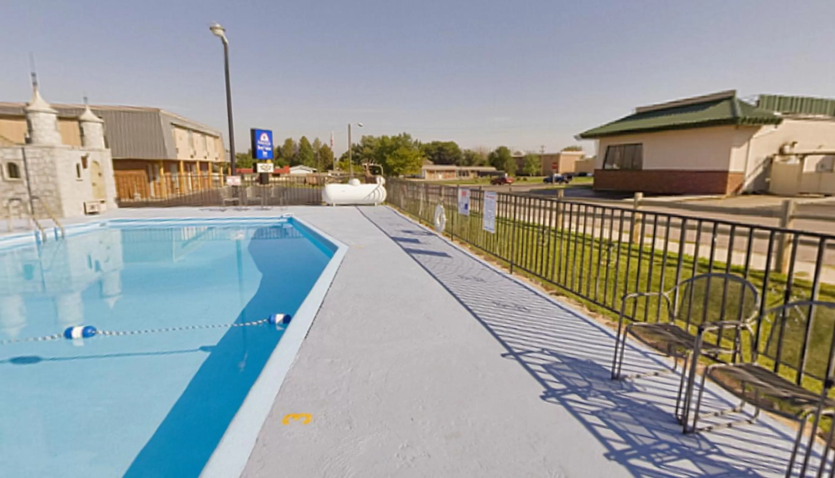 Swimming pool in Americas Best Value Inn Wall