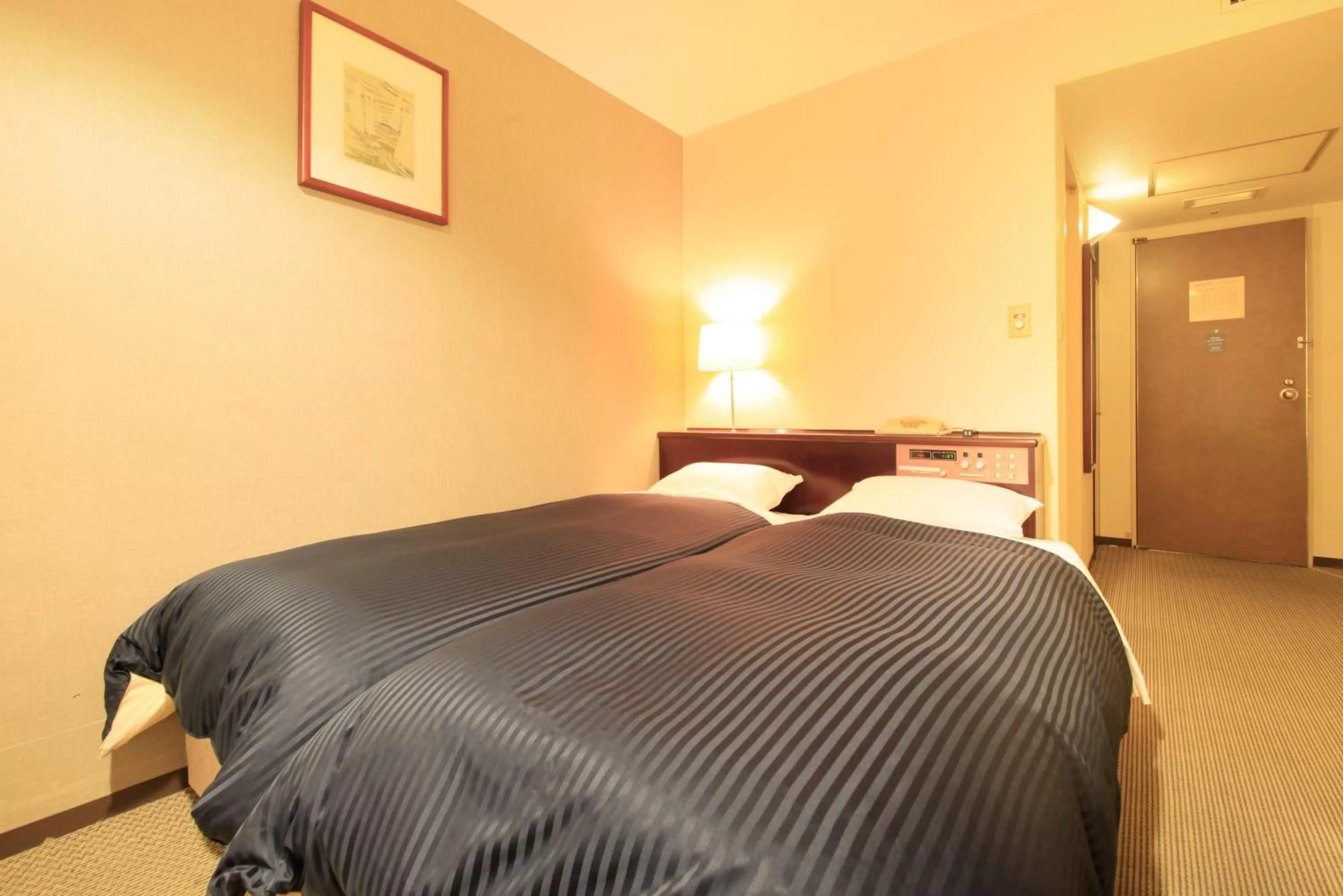 Photo of the whole room, Bed in Quintessa Hotel Ogaki