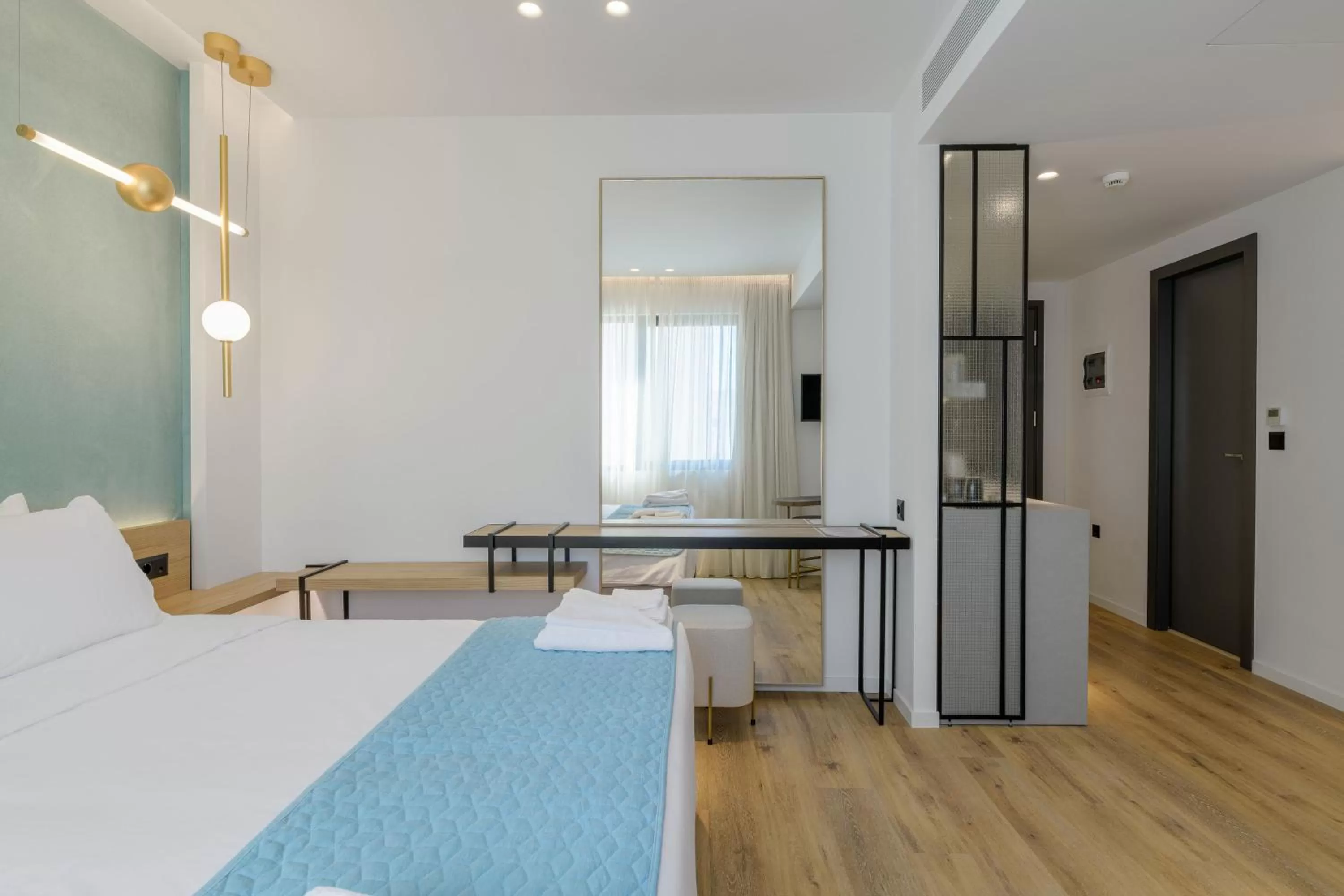 Bed in Acropolis Magenta Luxury Suites