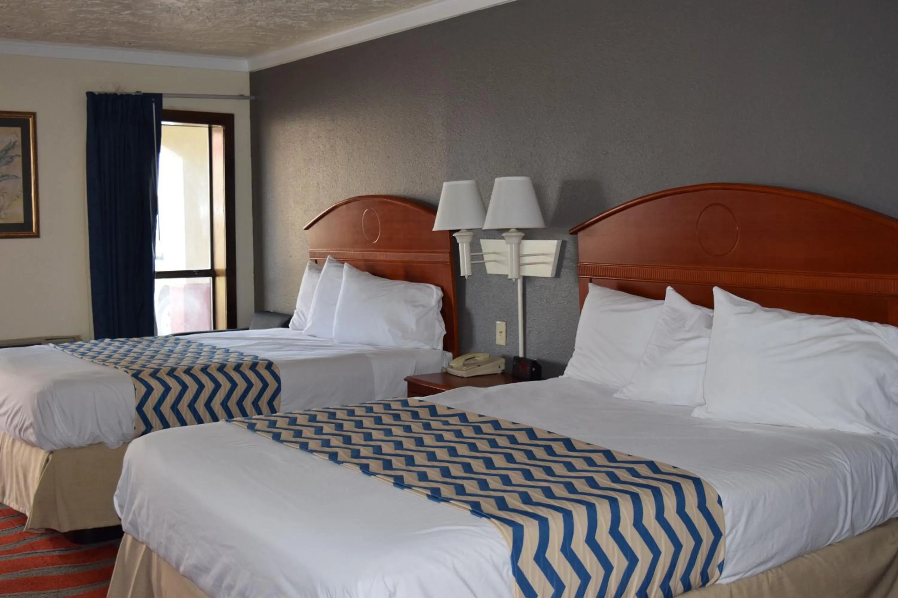 Bed in Travelodge Inn & Suites by Wyndham Norman