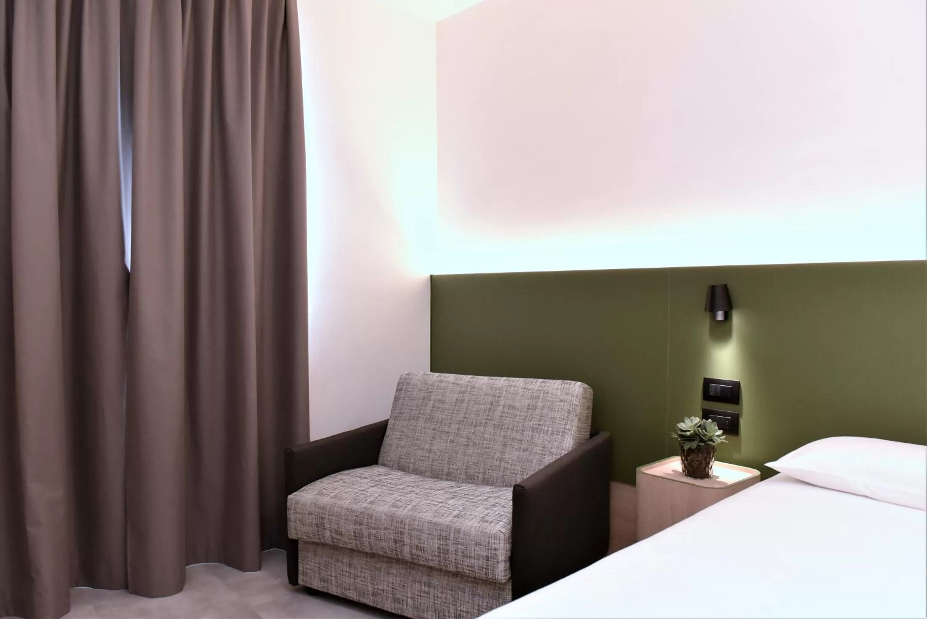 Seating area, Bed in Hotel Casa Del Pellegrino