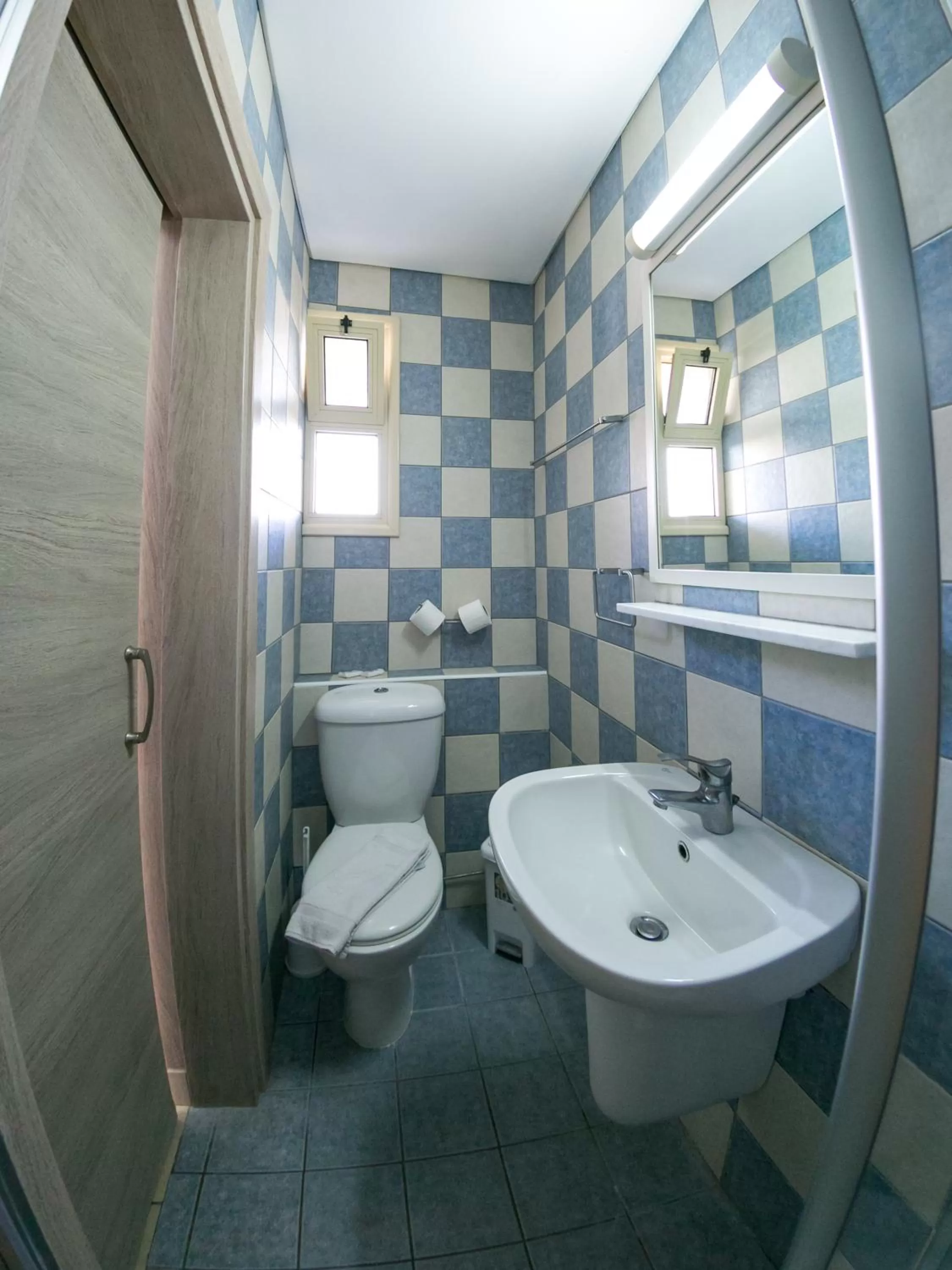 Toilet in Crystallo Apartments