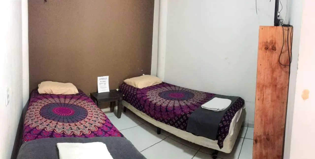 Bed in Pousada Casa de Vó