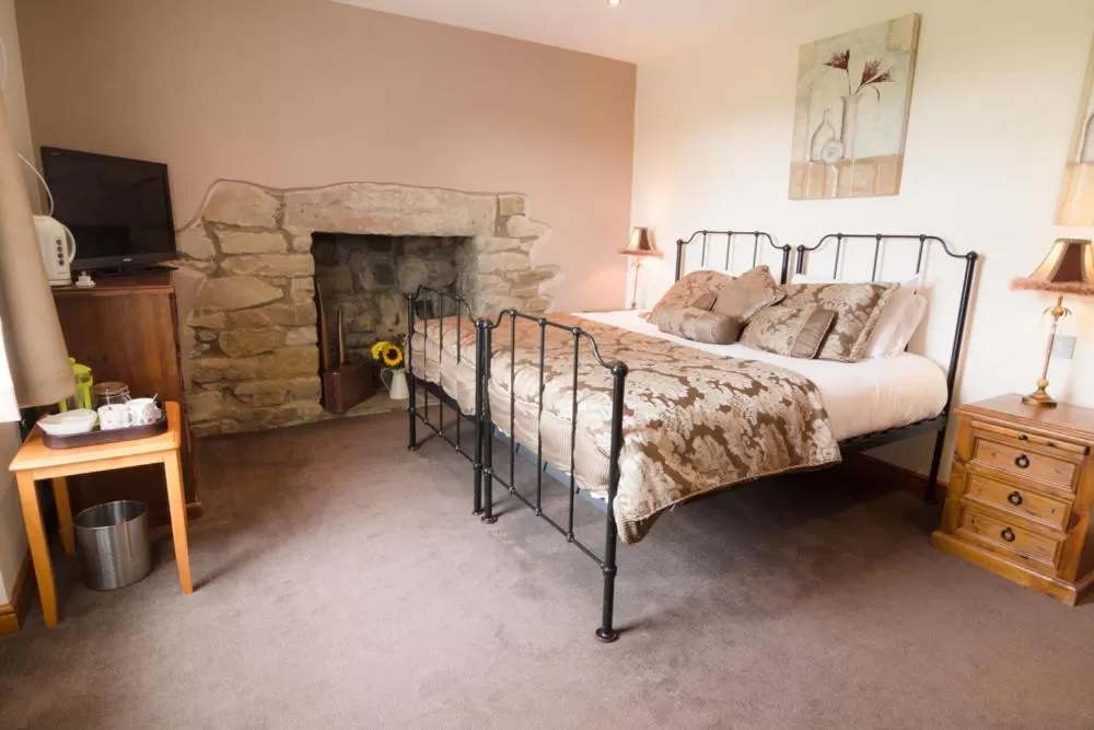 Bed in The Red Pump Inn