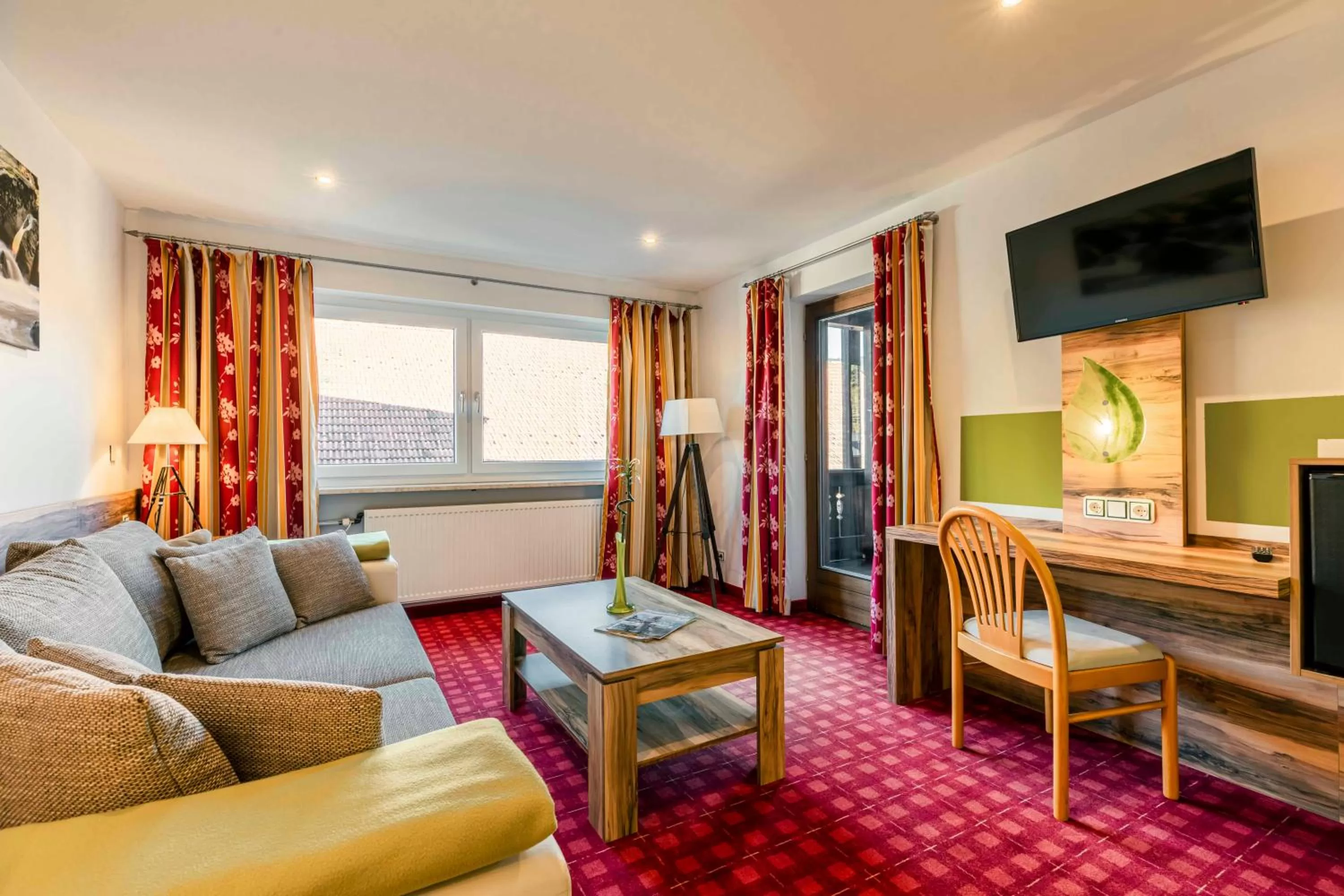 Communal lounge/ TV room in Landhotel GrünWies -Bonsai-Wellness Garni