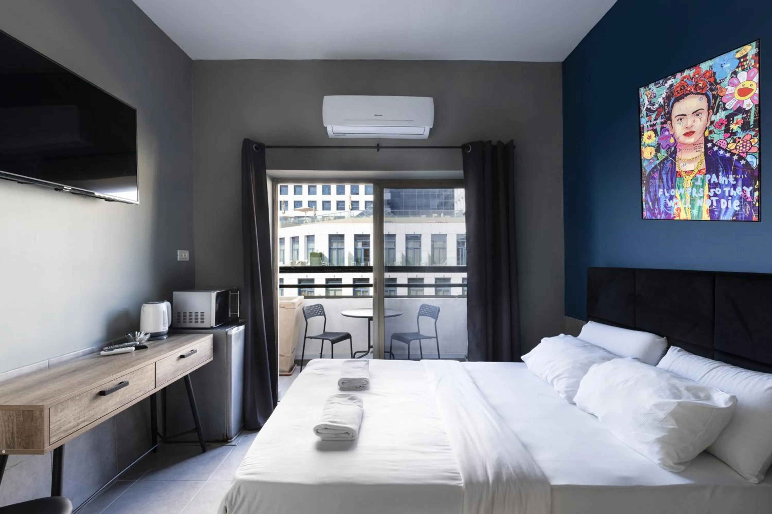 Photo of the whole room, Bed in Liber Tel Aviv Sea Shore Suites BY RAPHAEL HOTELS