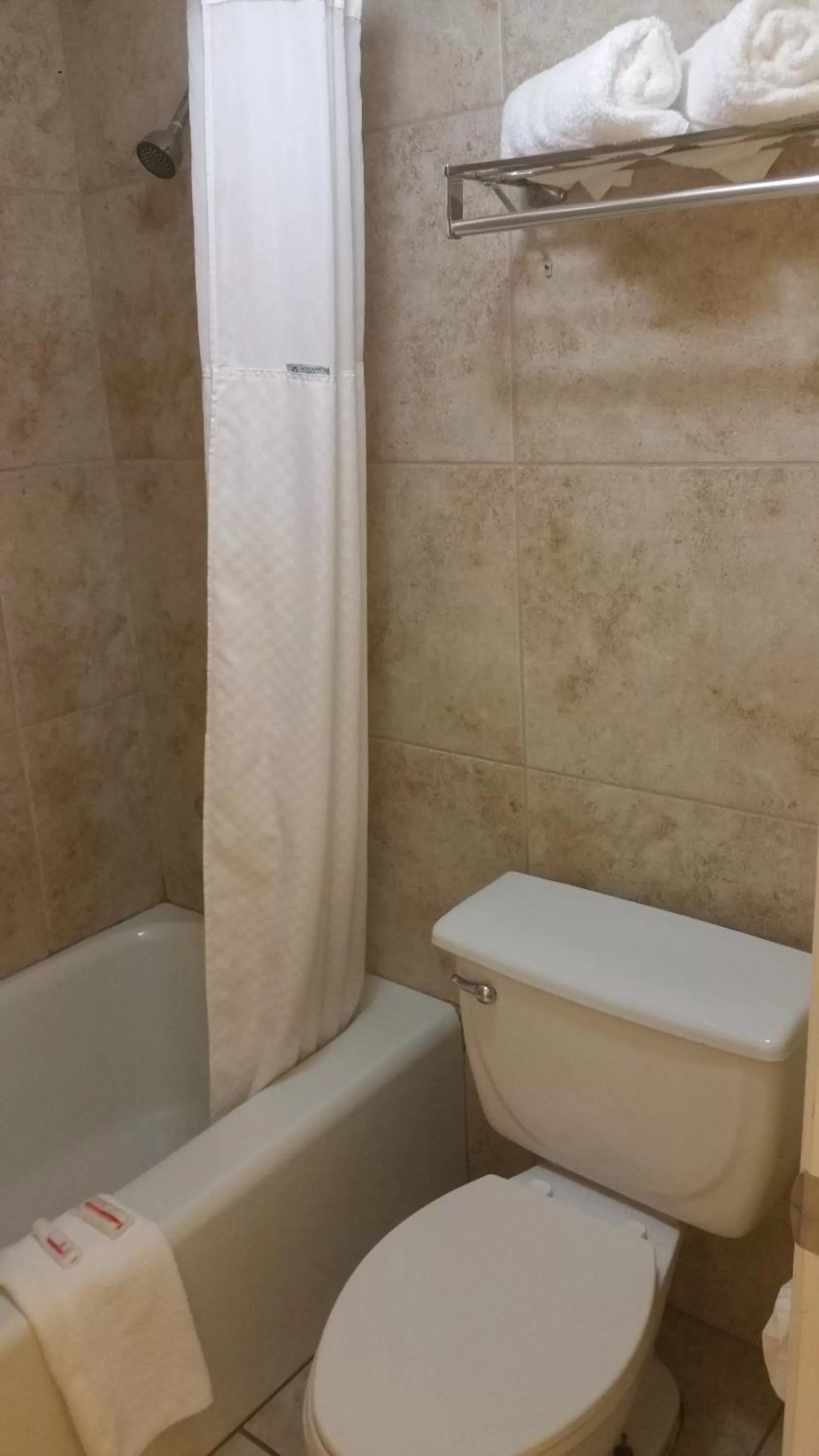 Bathroom in Days Inn by Wyndham Cocoa Cruiseport West At I-95/524