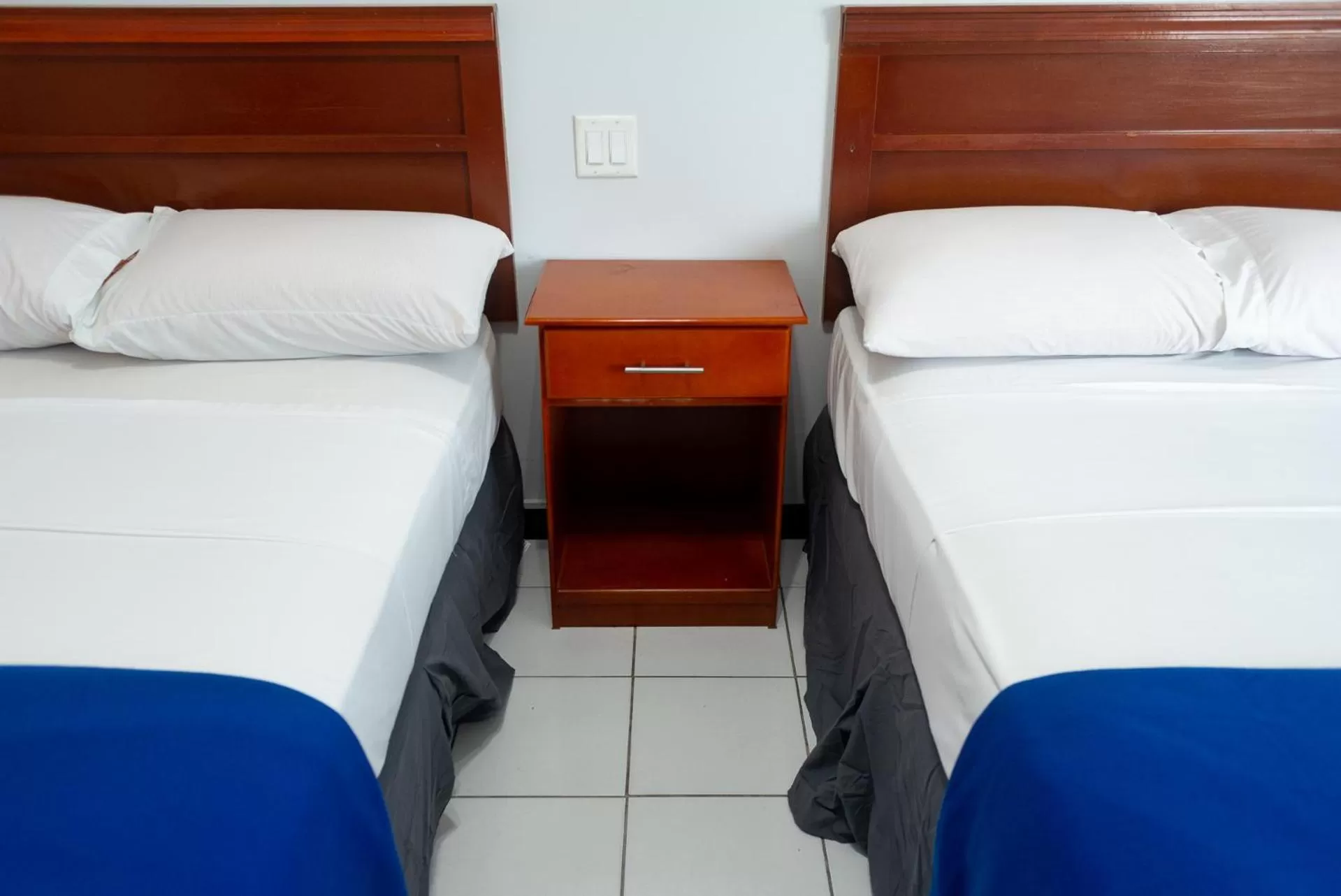 Bed in Status International Hotel