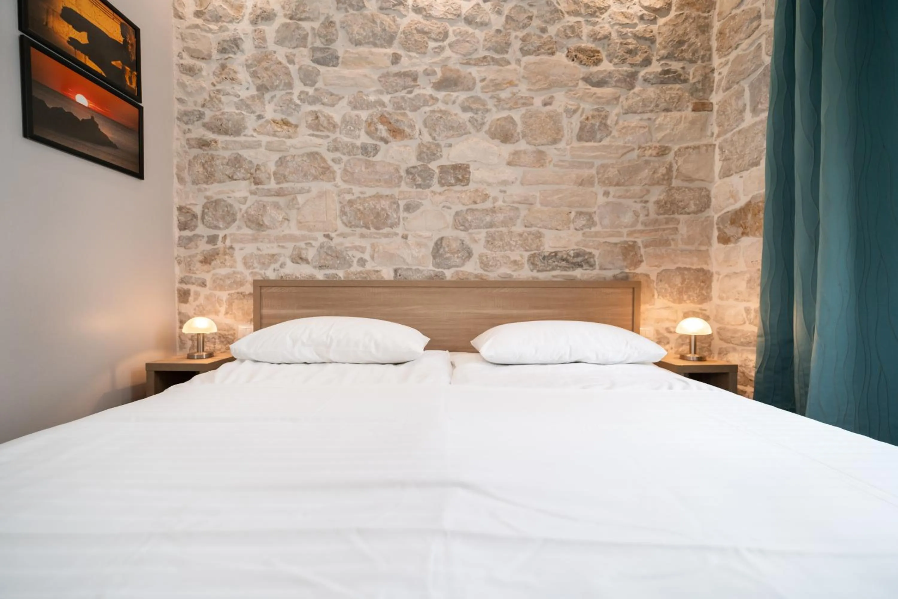 Bed in Tifani Luxury Rooms