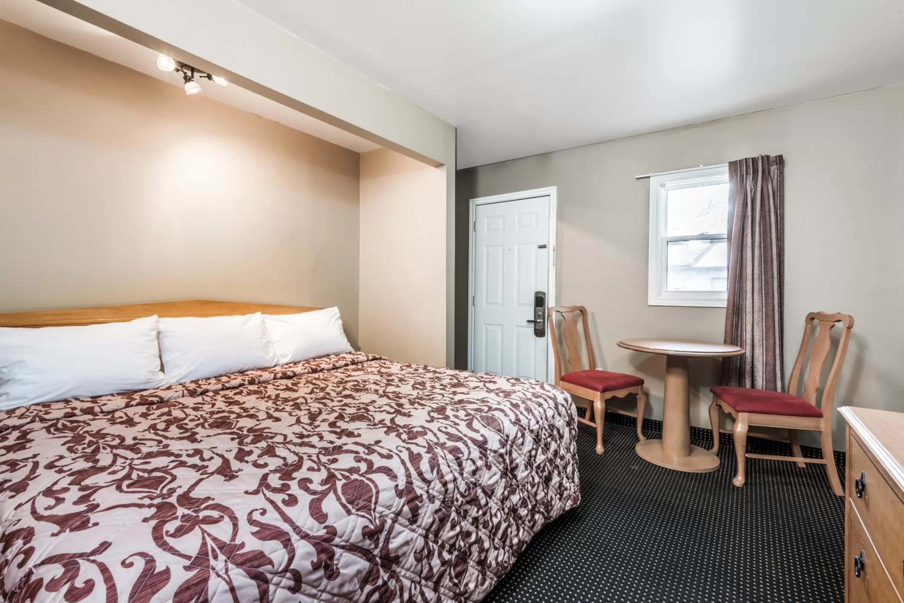 Day, Bed in Knights Inn London Ontario