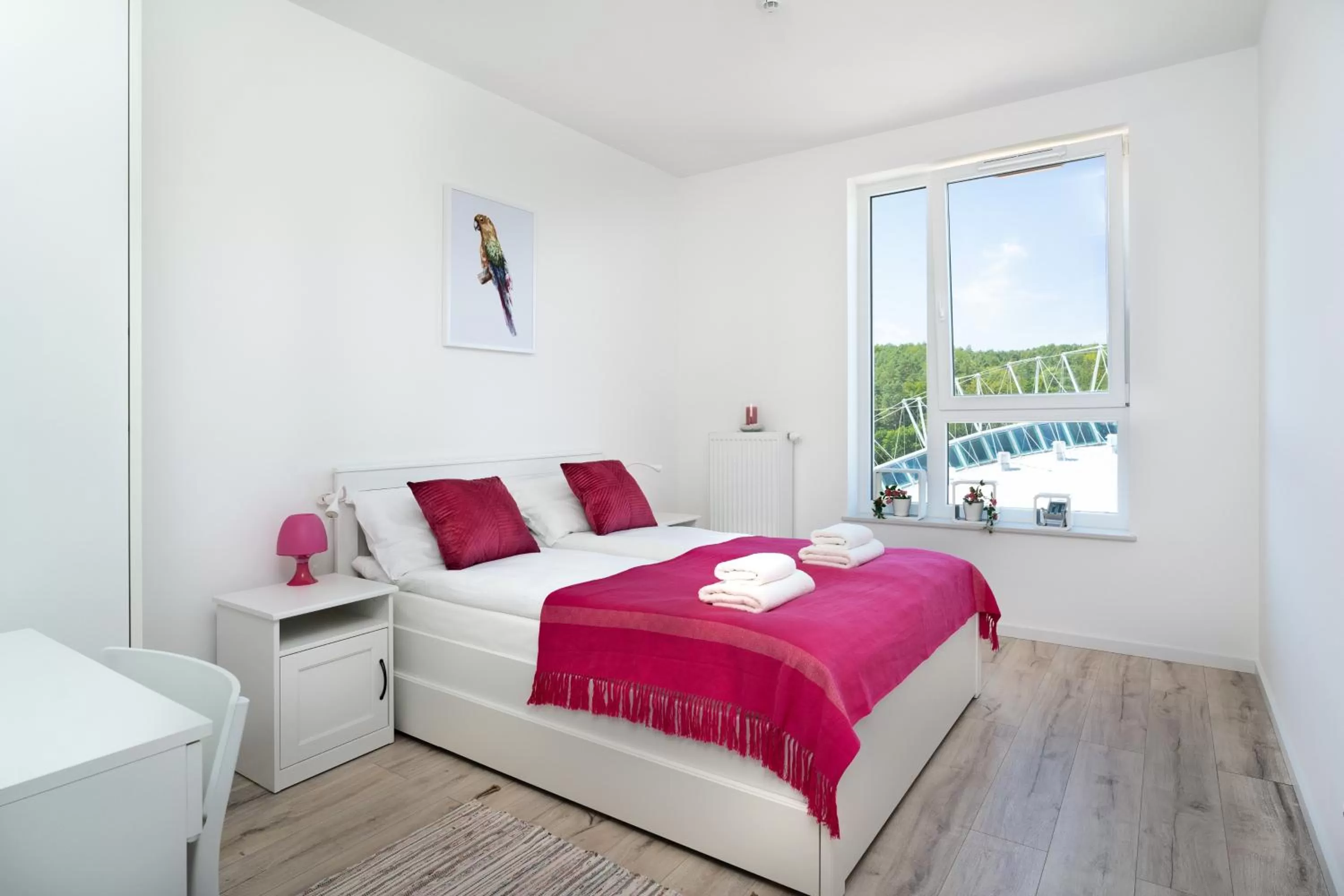 Bed in Symphony Modern Tower Apartamenty