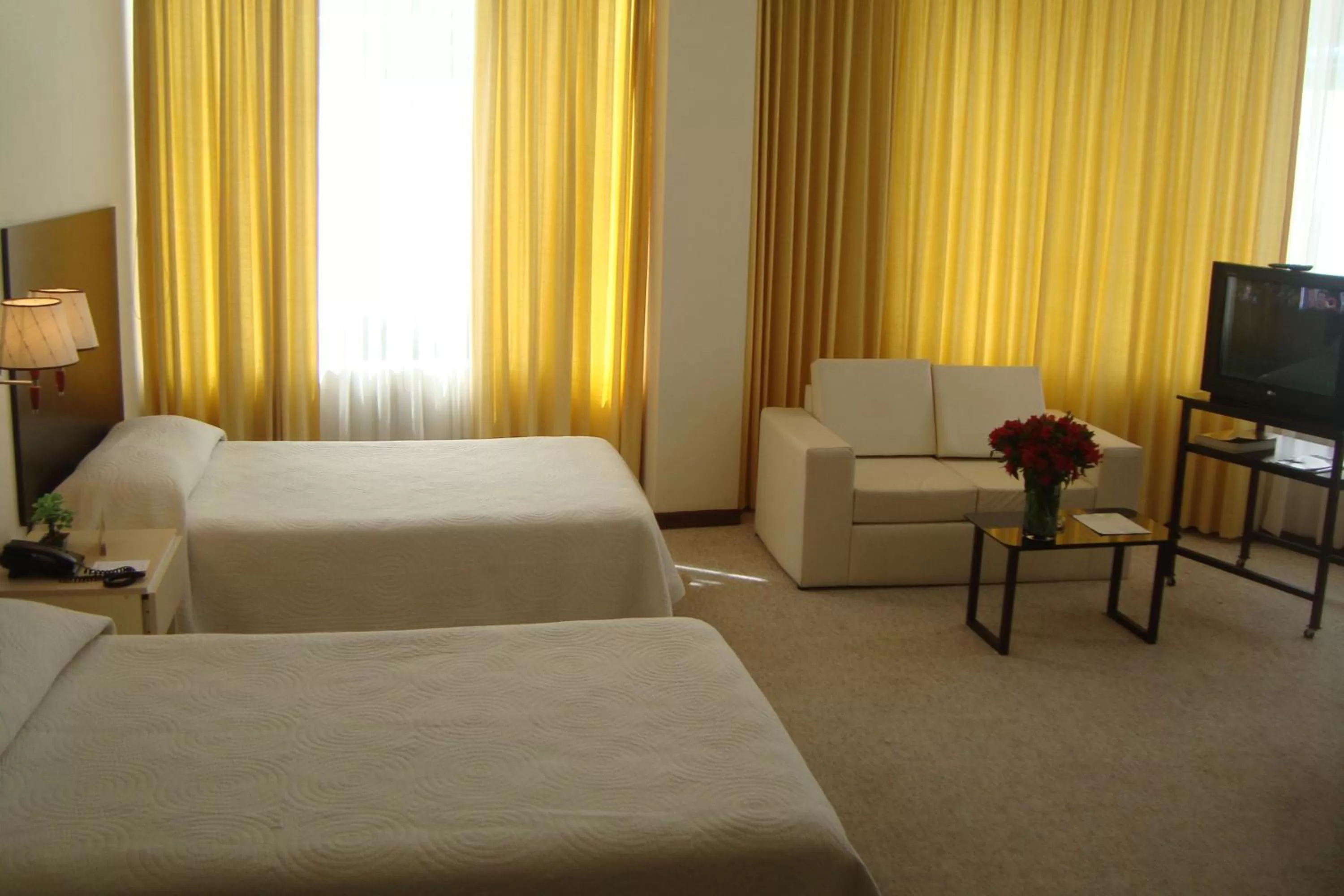 Bed in Delfines Apart Hotel