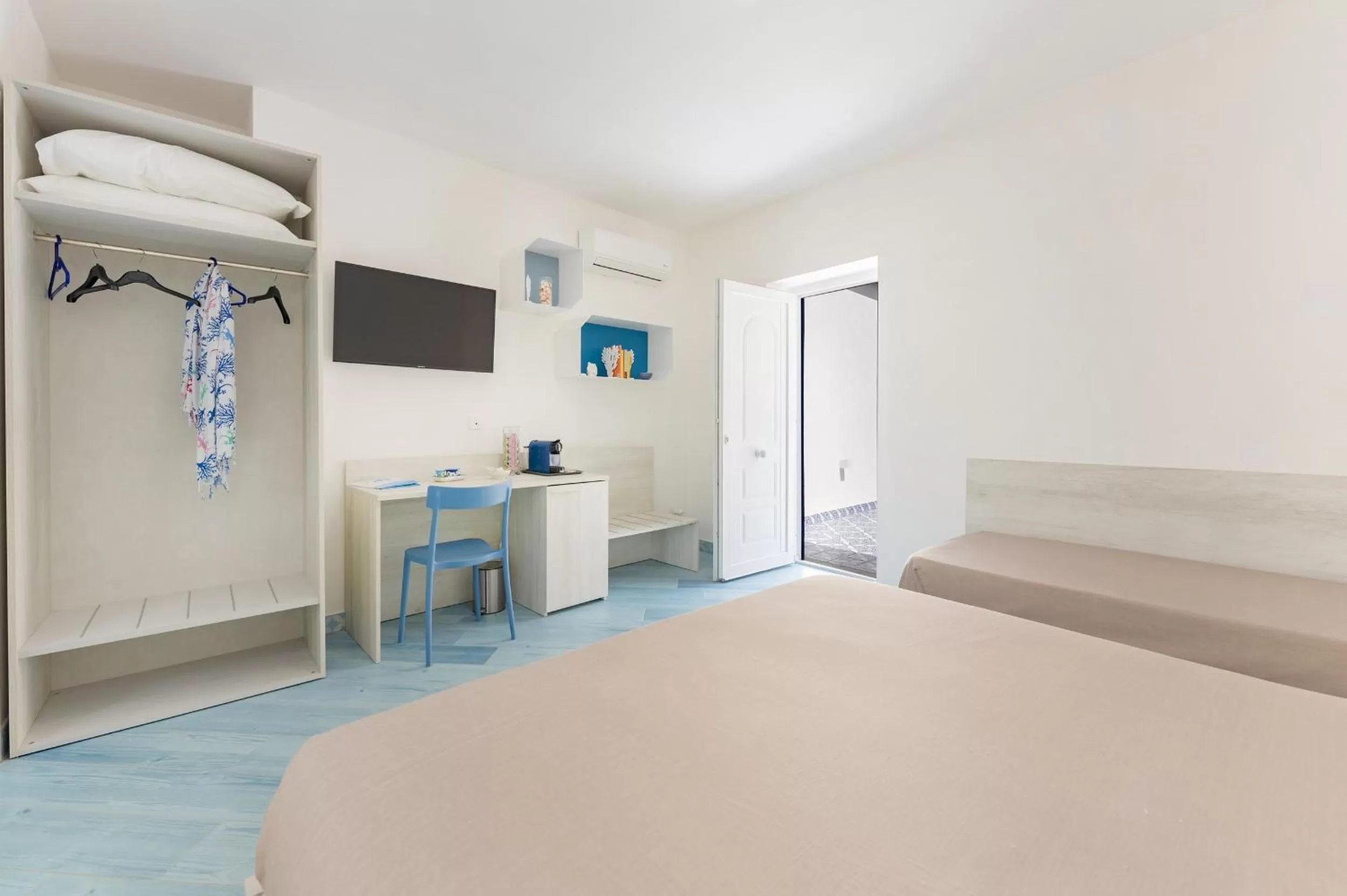 Bed in Poseidonia Rooms