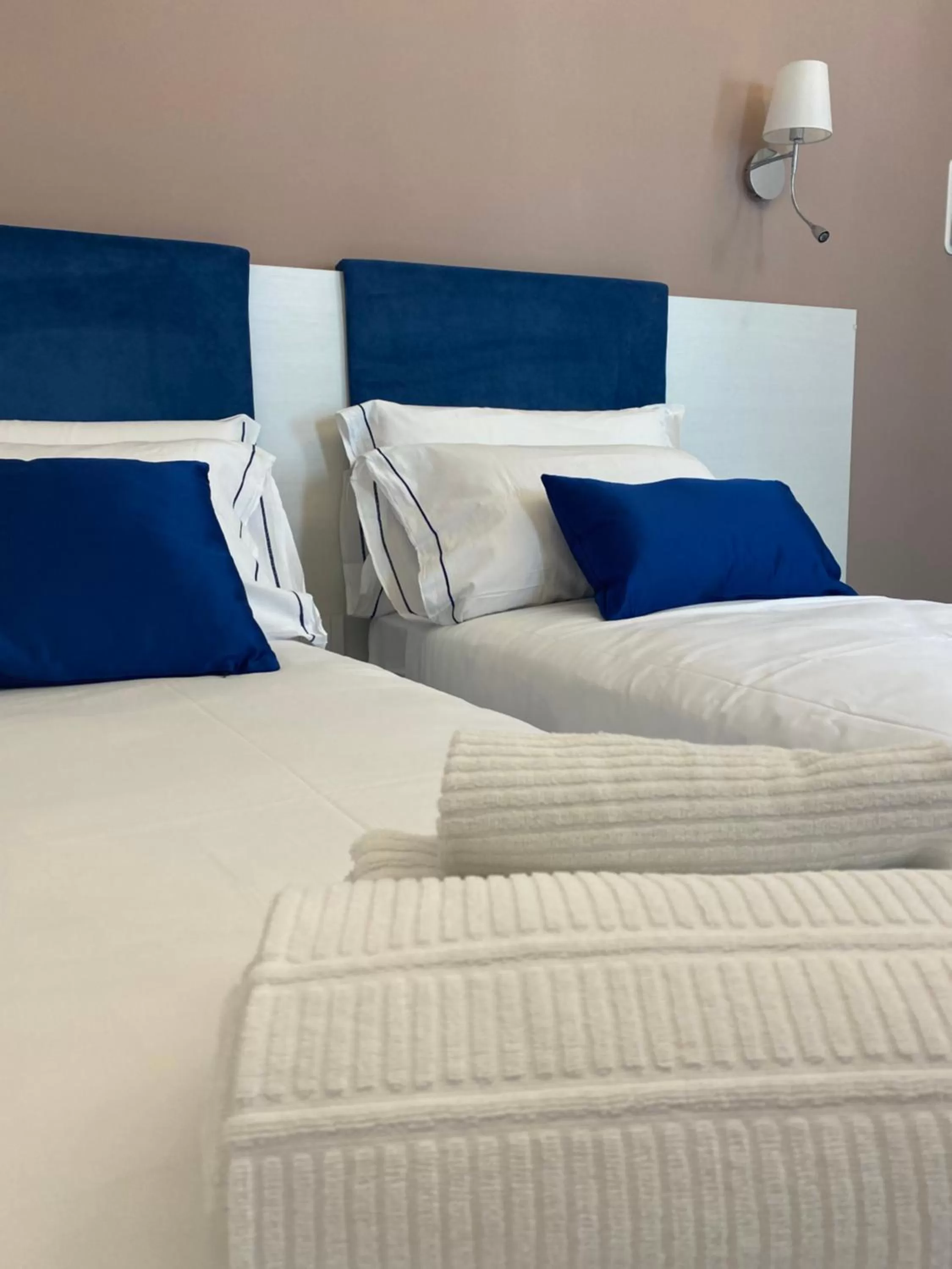 Bed in Palazzo Cappuccini Art Relais