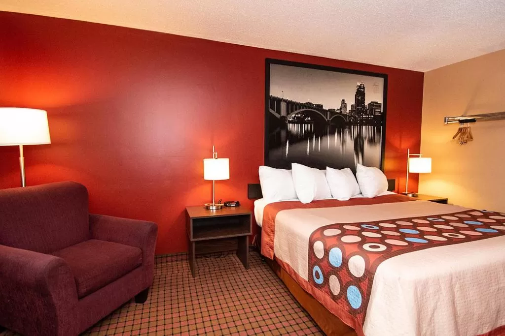 Bed in Super 8 by Wyndham Brooklyn Center/MPLS