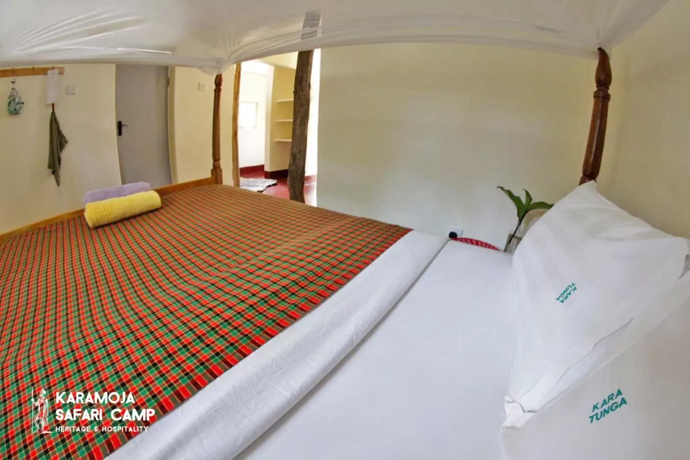 Bed in Kara-Tunga Safari Camp