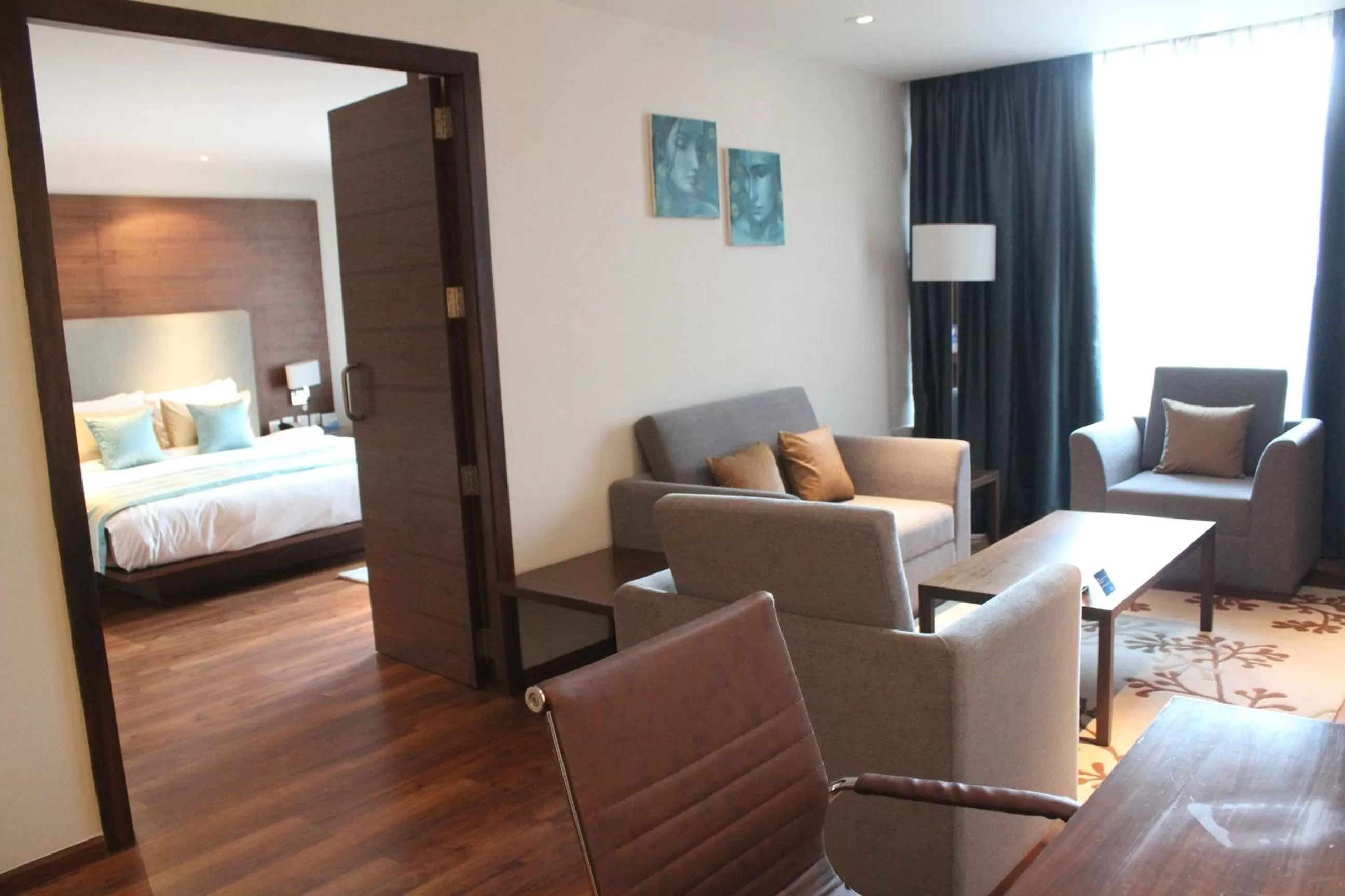 Living room, Bed in Radisson Blu Plaza Hotel Hyderabad Banjara Hills