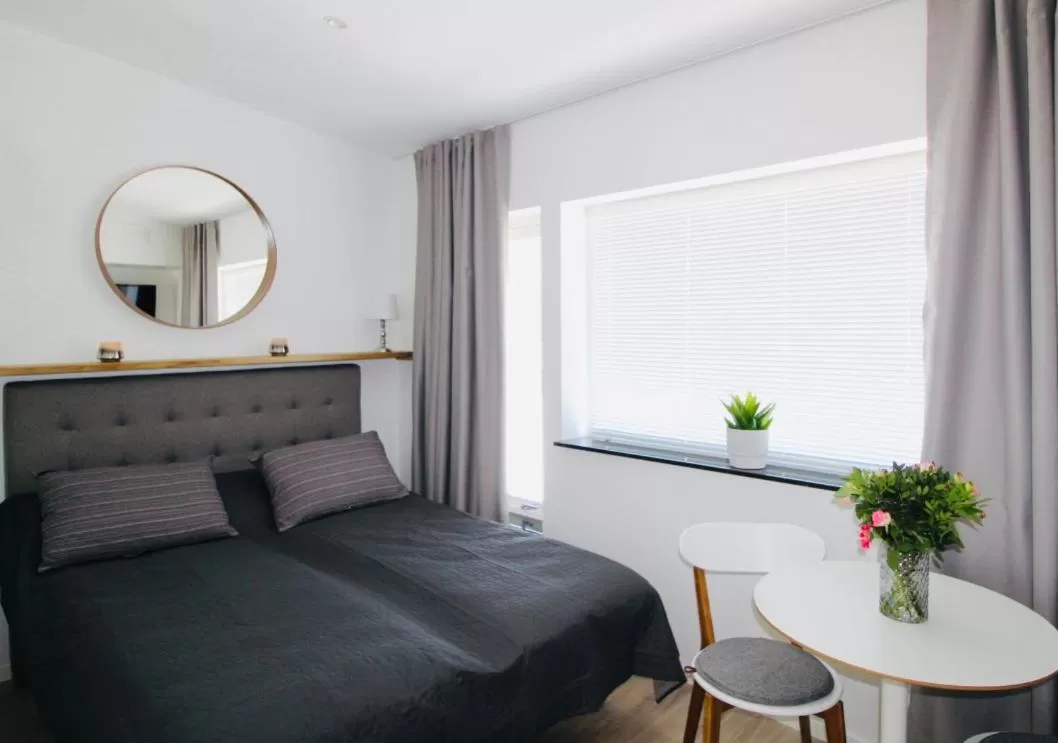 Bed in Easy Livin' Apartment Hotel