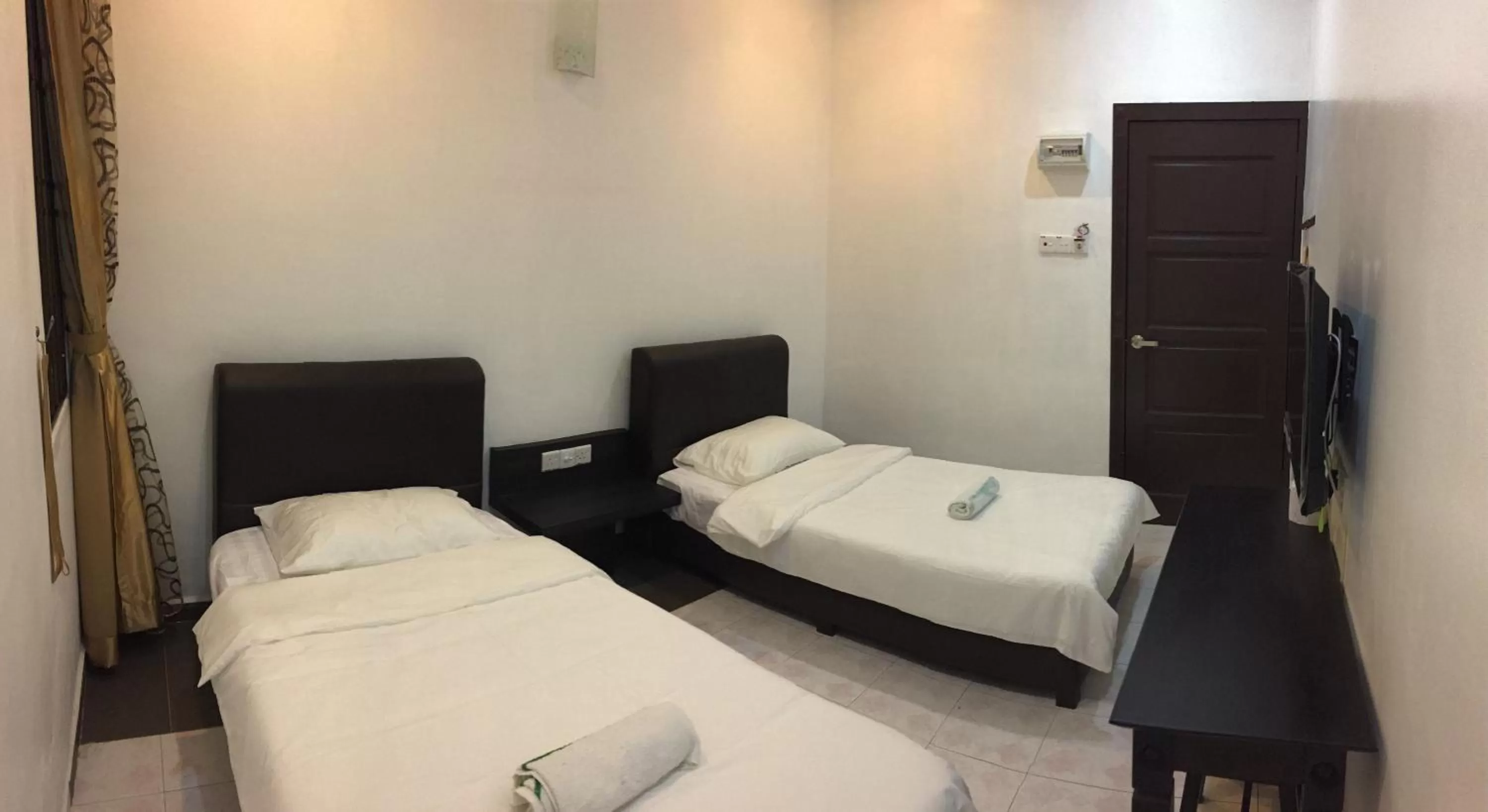 Photo of the whole room, Bed in Homestay Muar