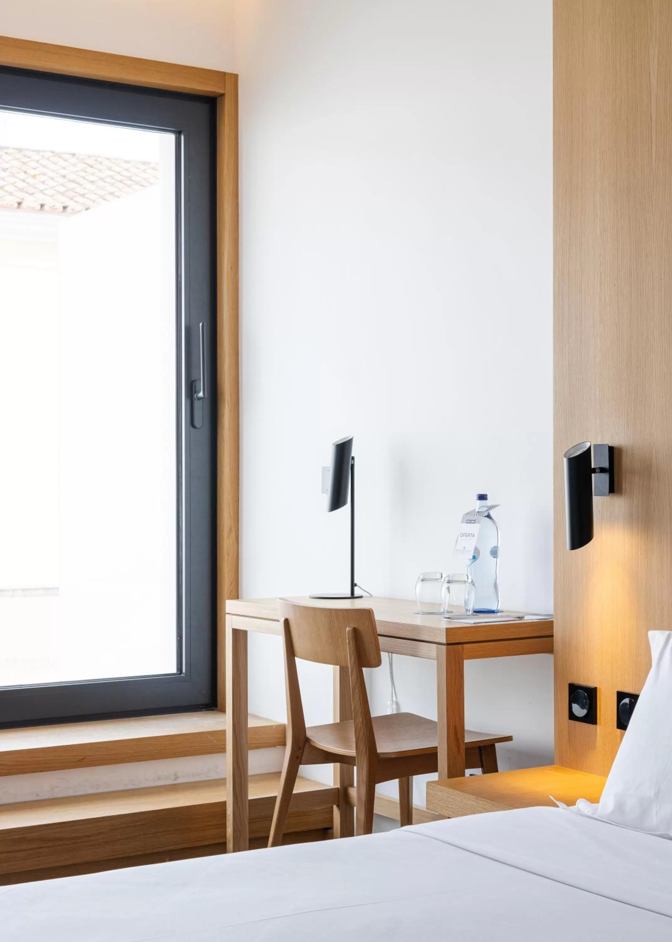 Seating area, Bed in Evora Olive Hotel
