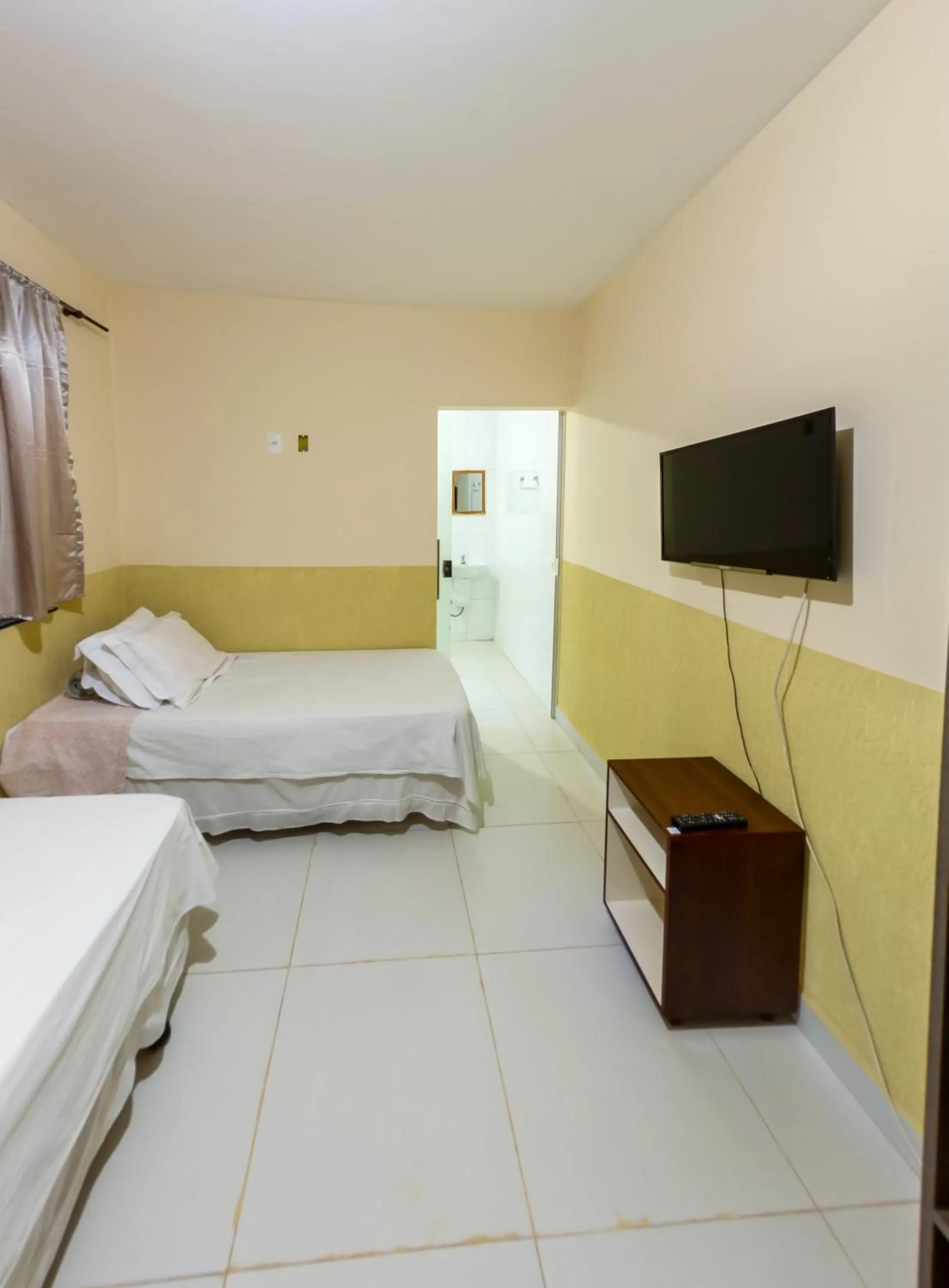 Bed in Pousada Jardim Brasília