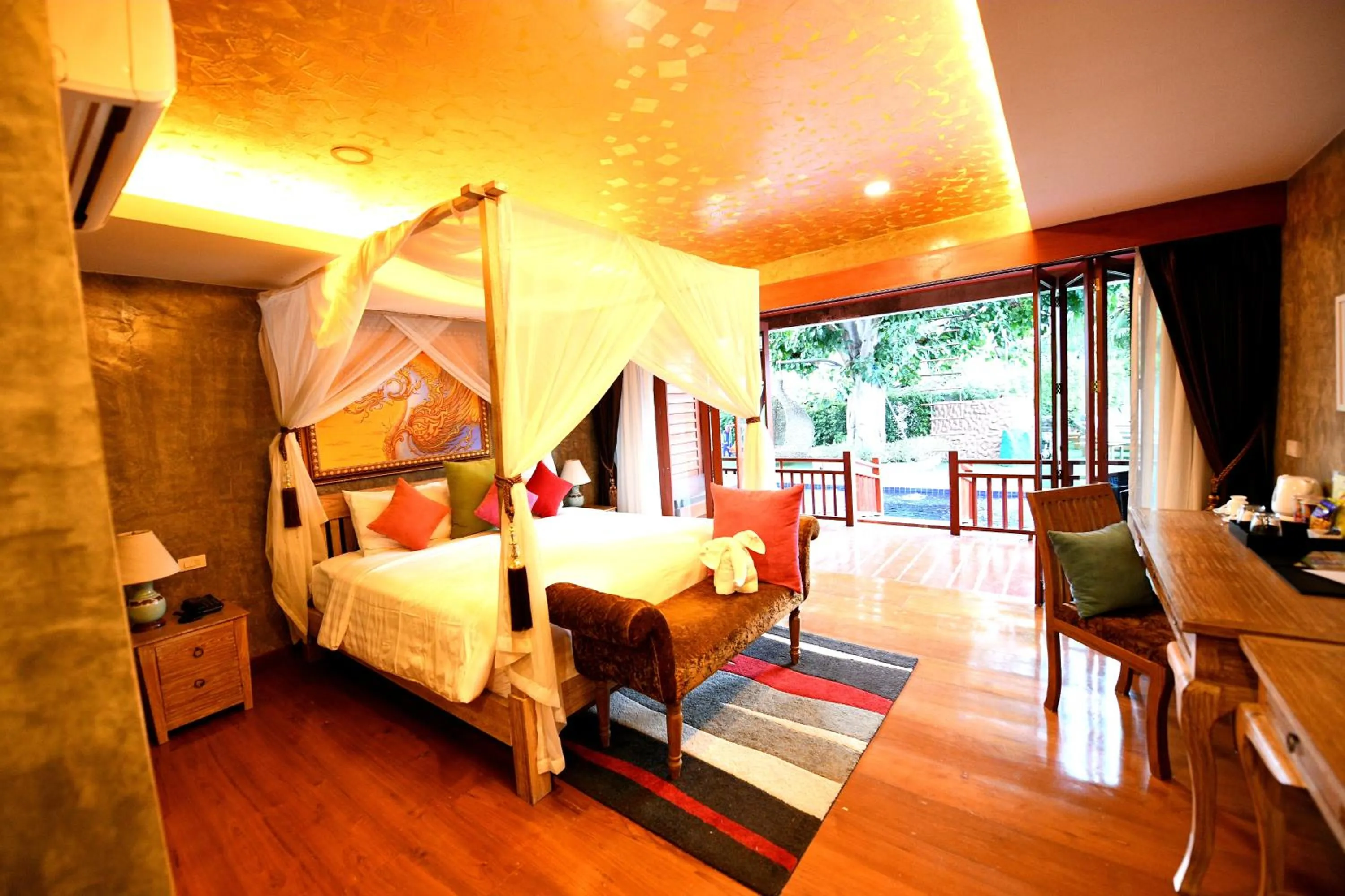 Bed in The Chaya Resort and Spa