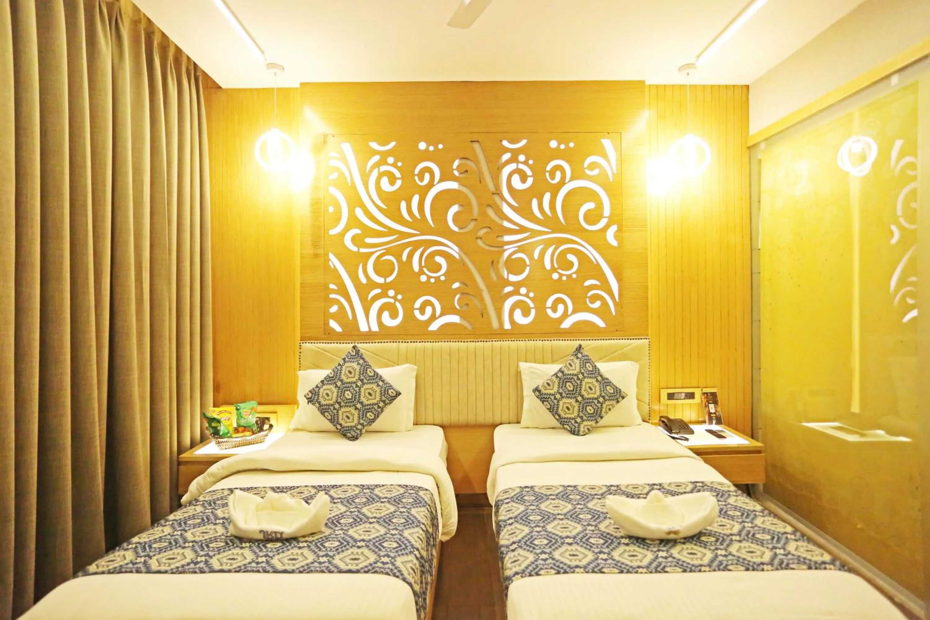 Bed in JRD Luxury-Business Hotel