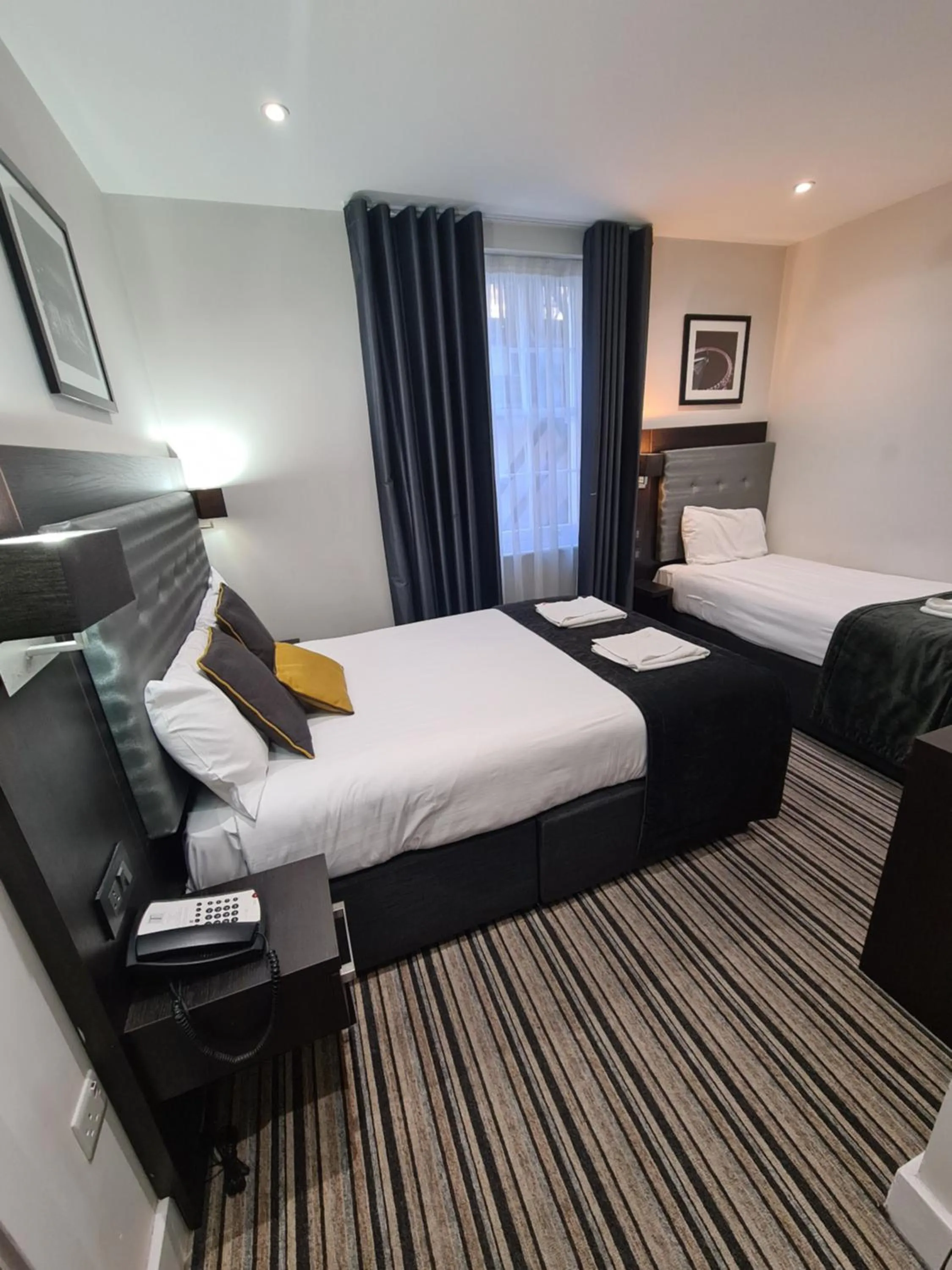 Bed in The Tudor Inn Hotel