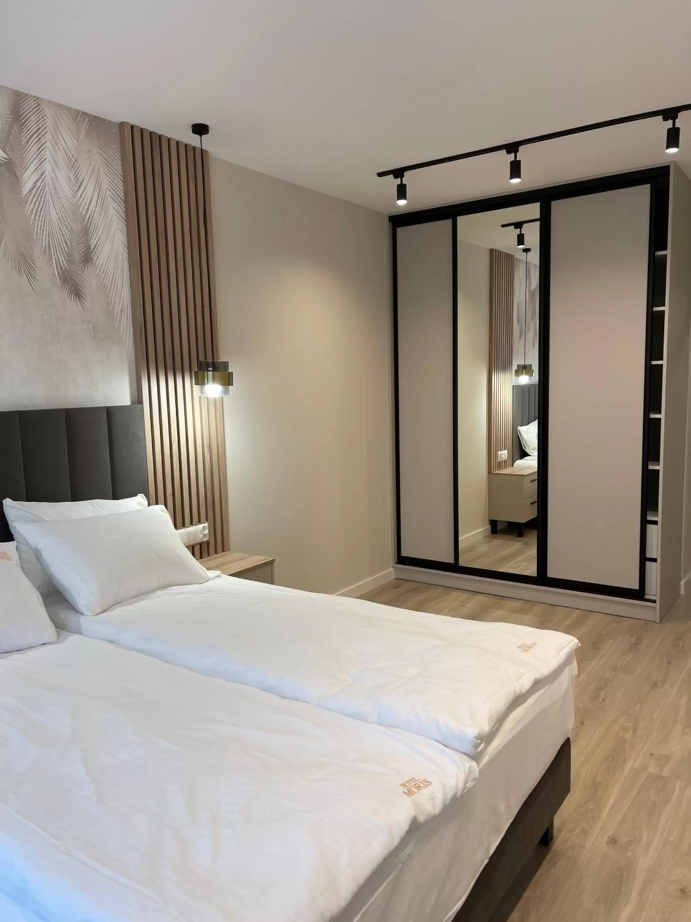 Bed in Moris Boutique Beach Hotel