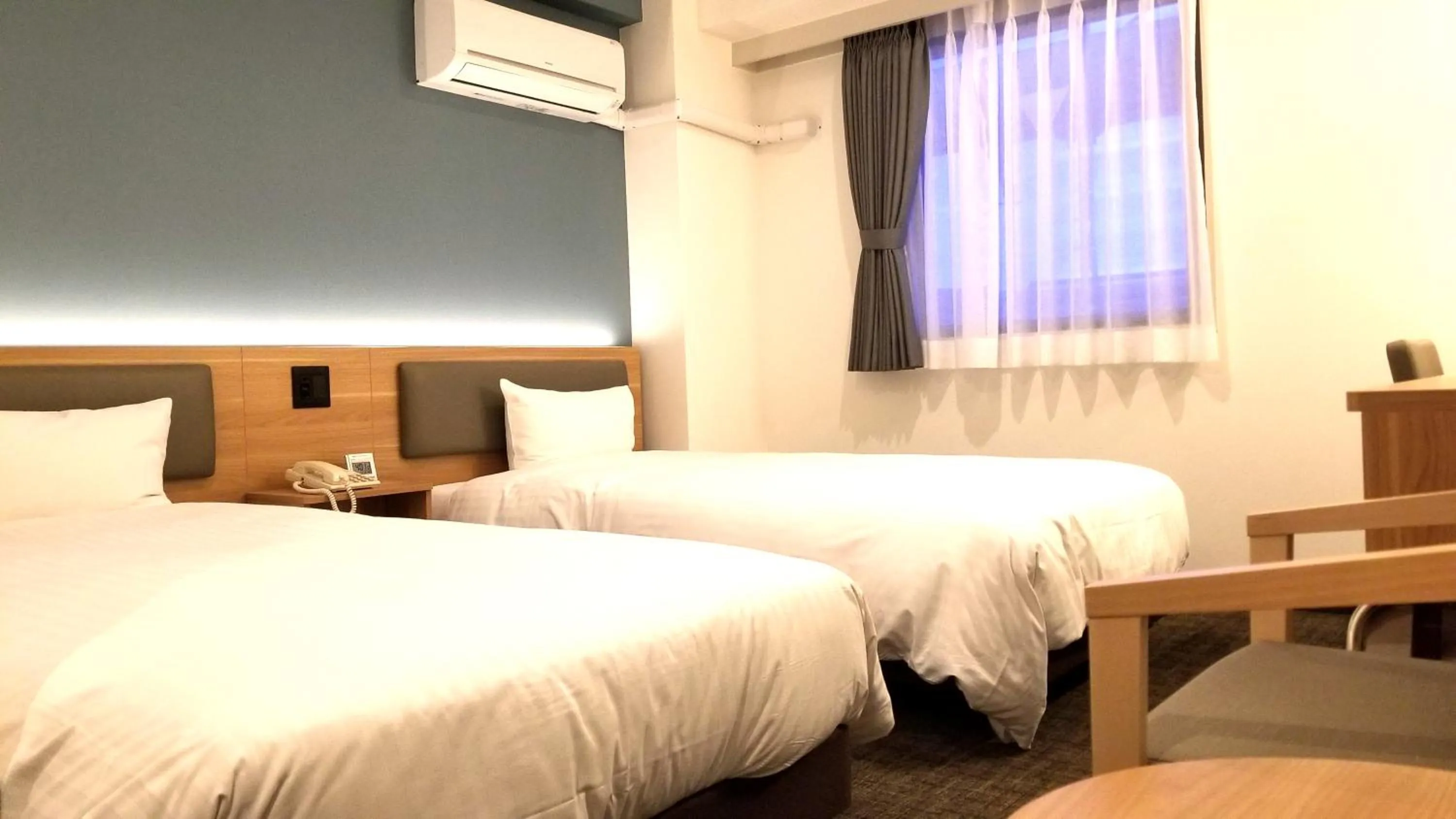 Bed in Kochi Sunrise Hotel