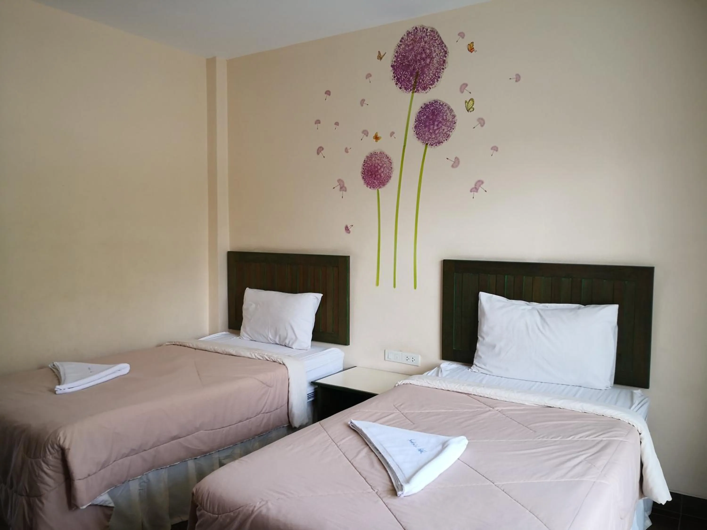 Bed in Baan Suksiri Hotel