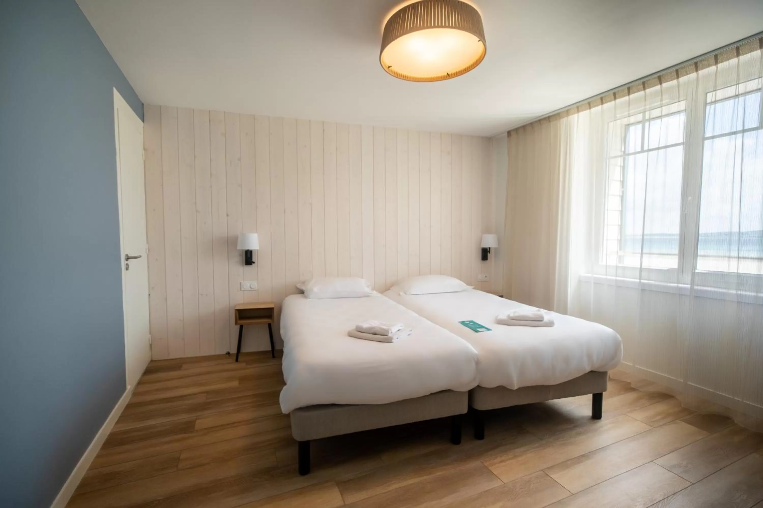 Bed in Hôtel de la Baie