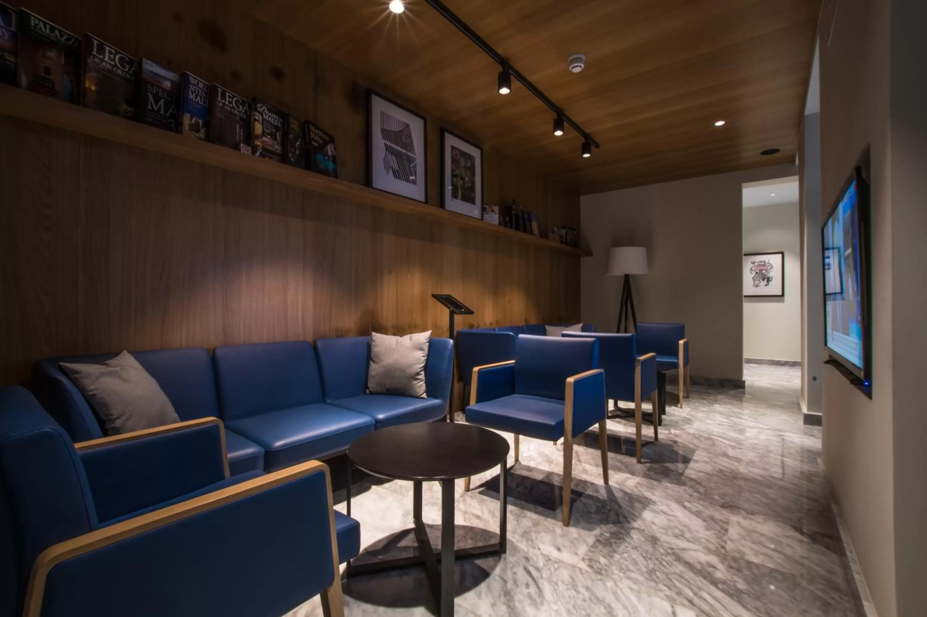 Communal lounge/ TV room in La Falconeria Hotel