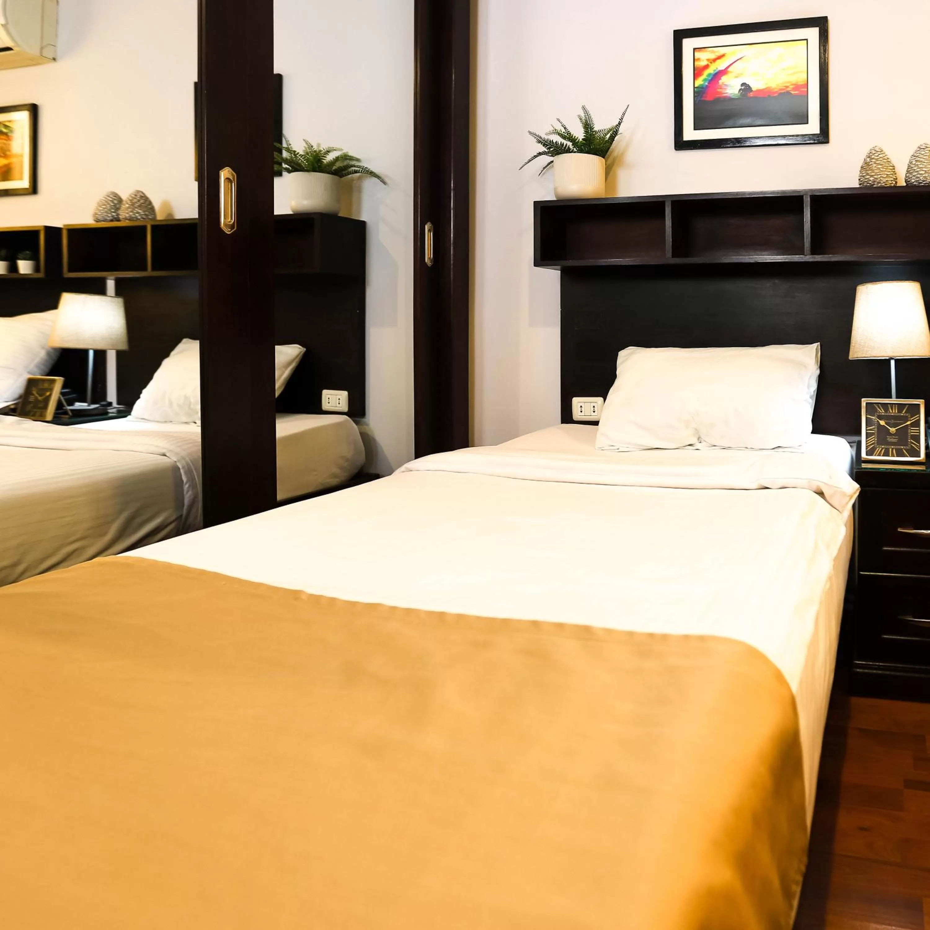 Bed in NewCity Hotel & Suites