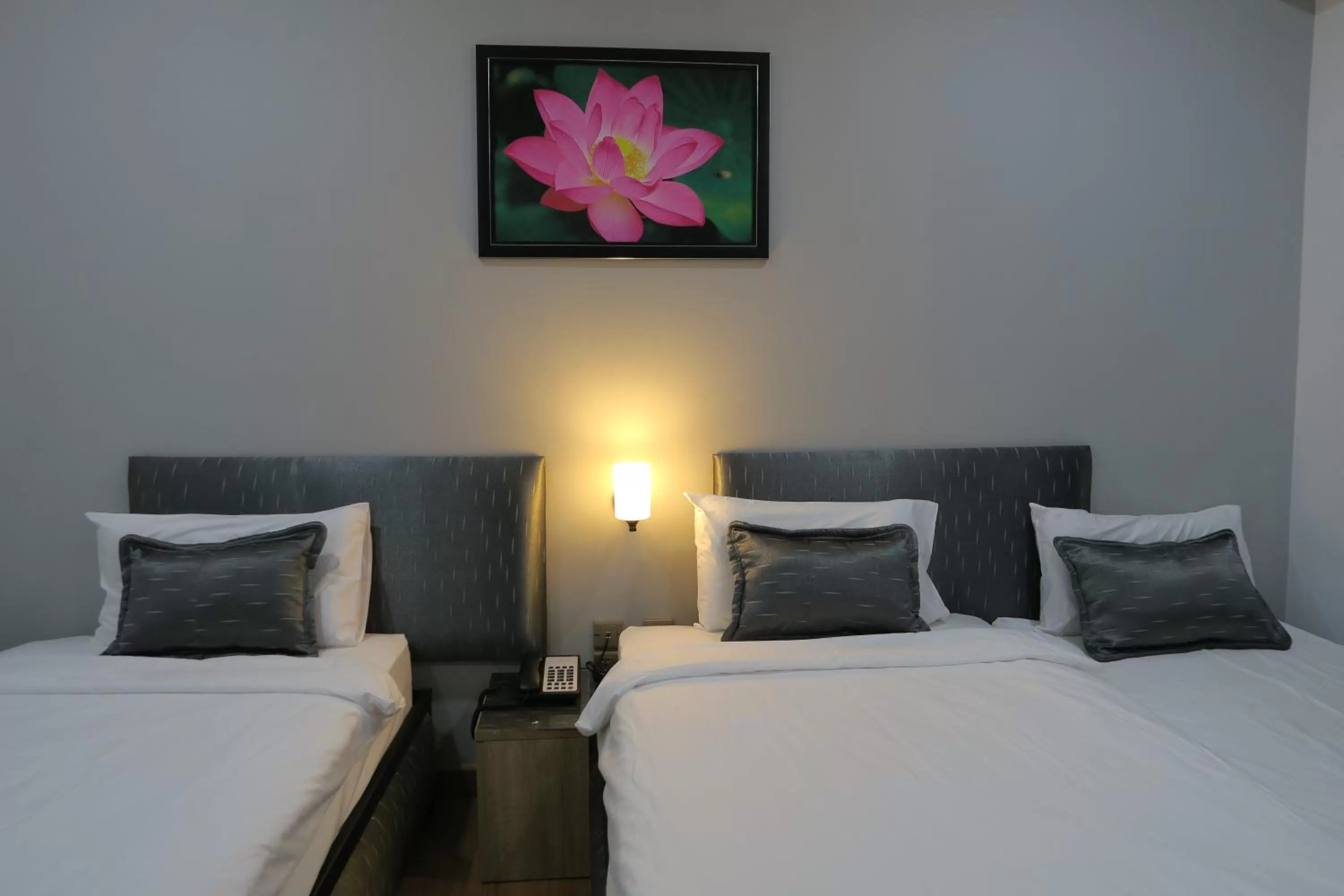 Bed in The Mira Hotel Chiang Rai