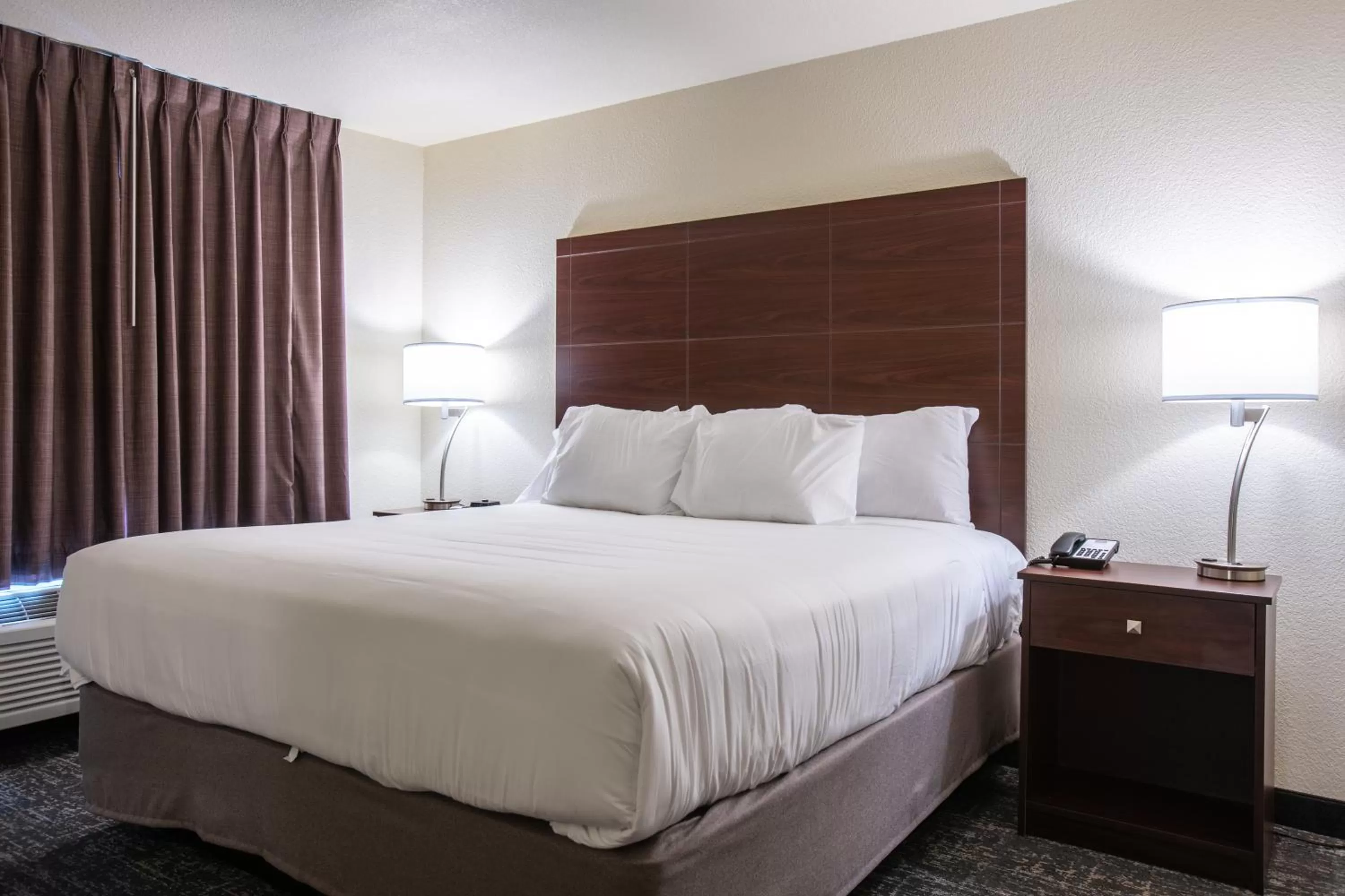 Bed in Cobblestone Inn & Suites - Pine Bluffs