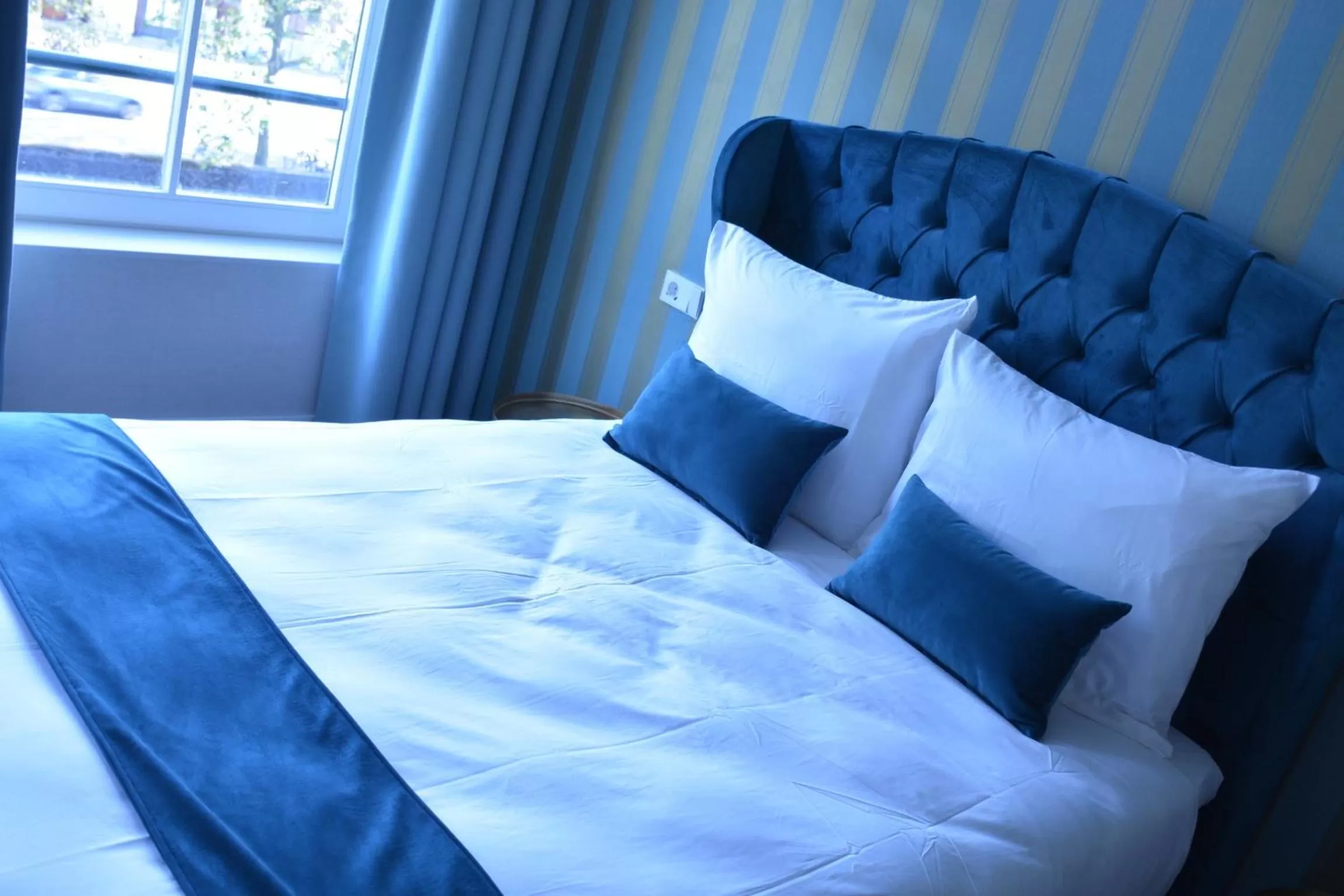 Bed in The IF Boutique hotel