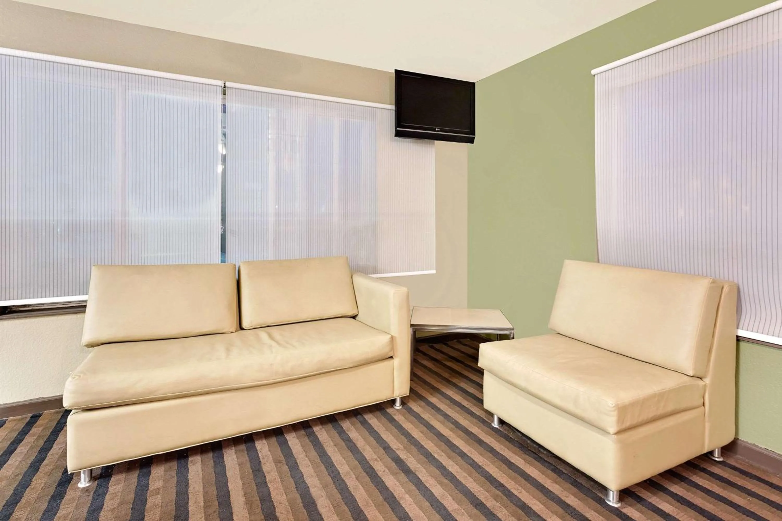 Seating area in Super 8 by Wyndham Denver Central