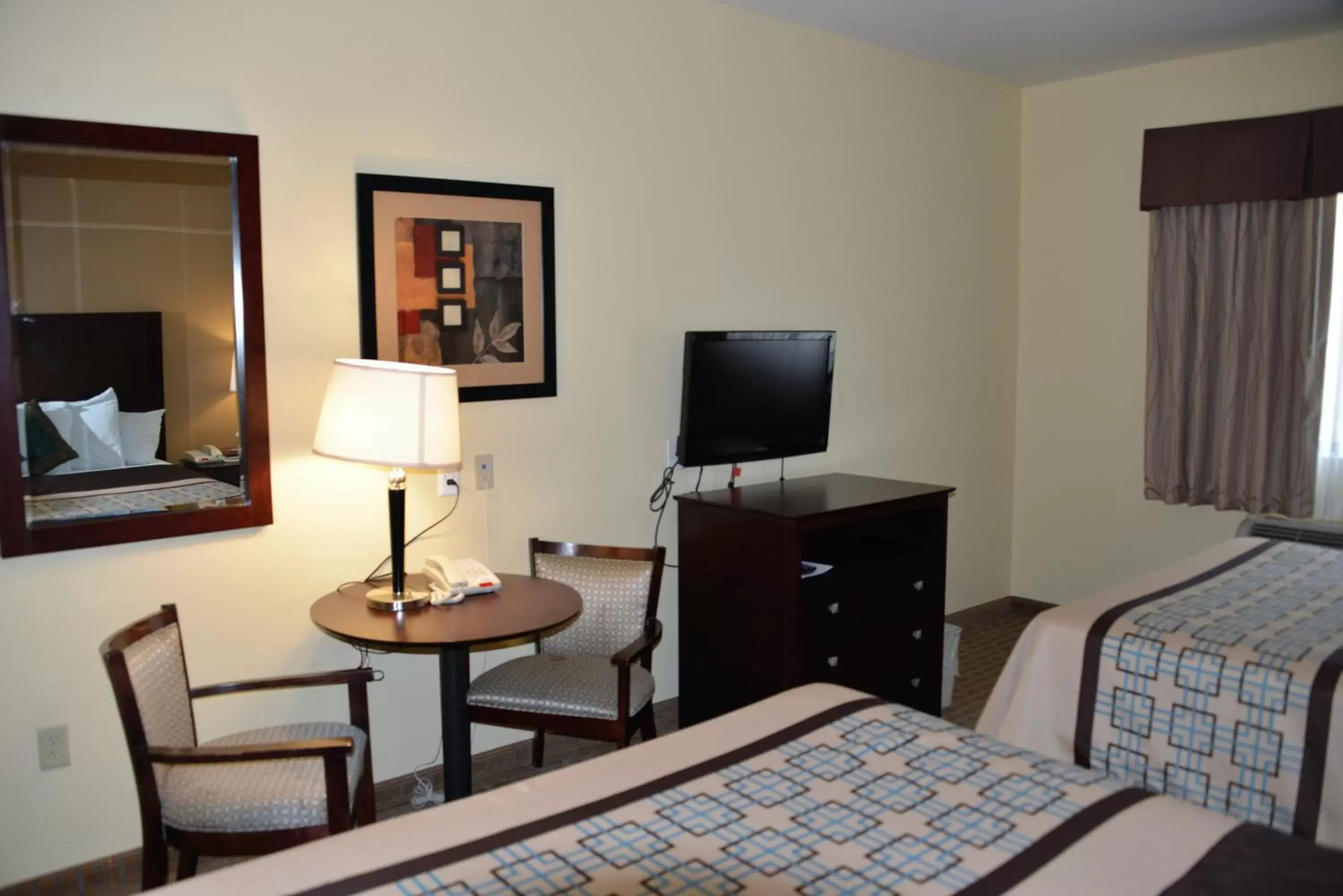 Queen Room with Two Queen Beds in Irish Inn and Suites Queen Room with Two Queen Beds in Irish Inn and Suites