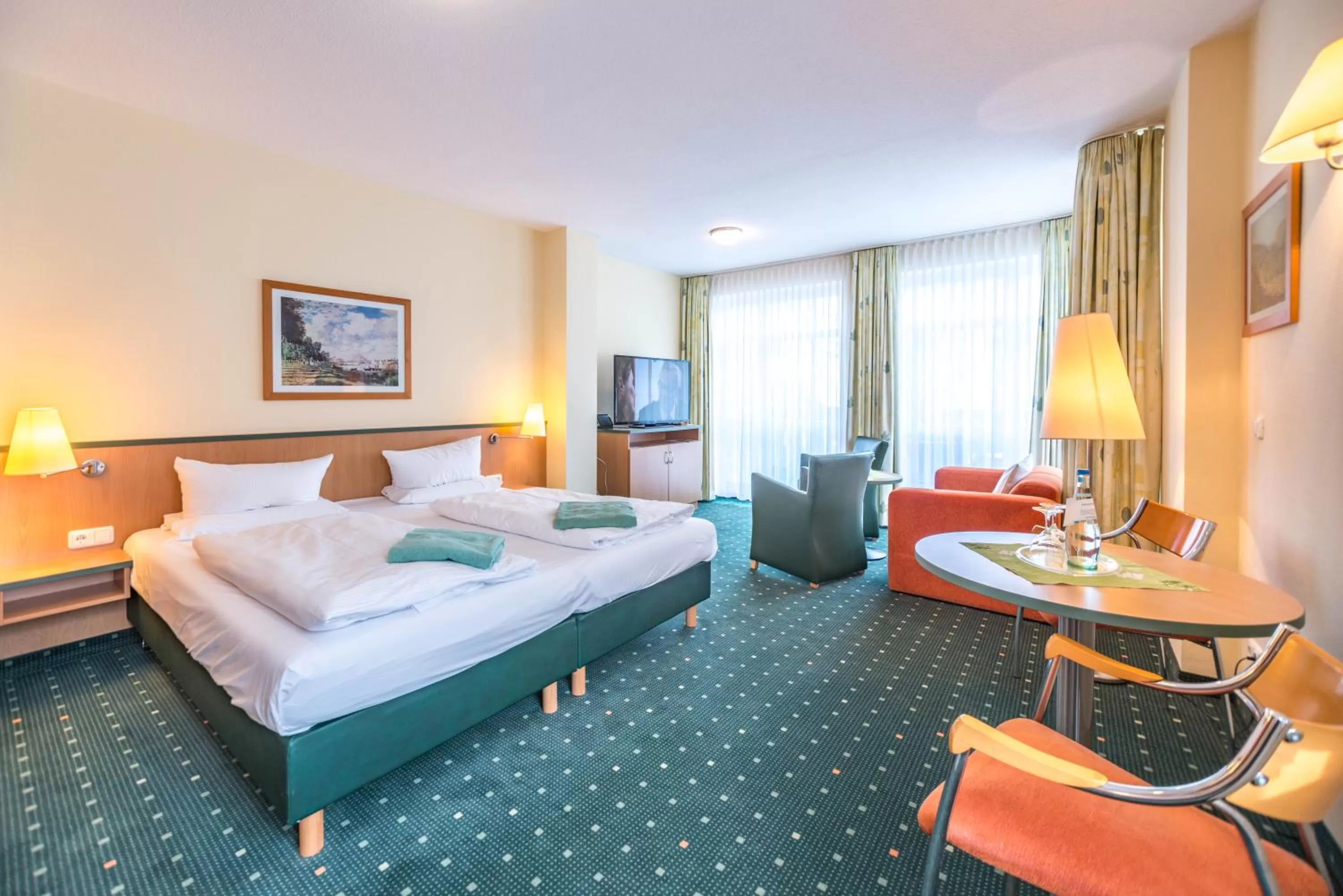 Living room, Bed in Am Weststrand Aparthotel Kühlungsborn