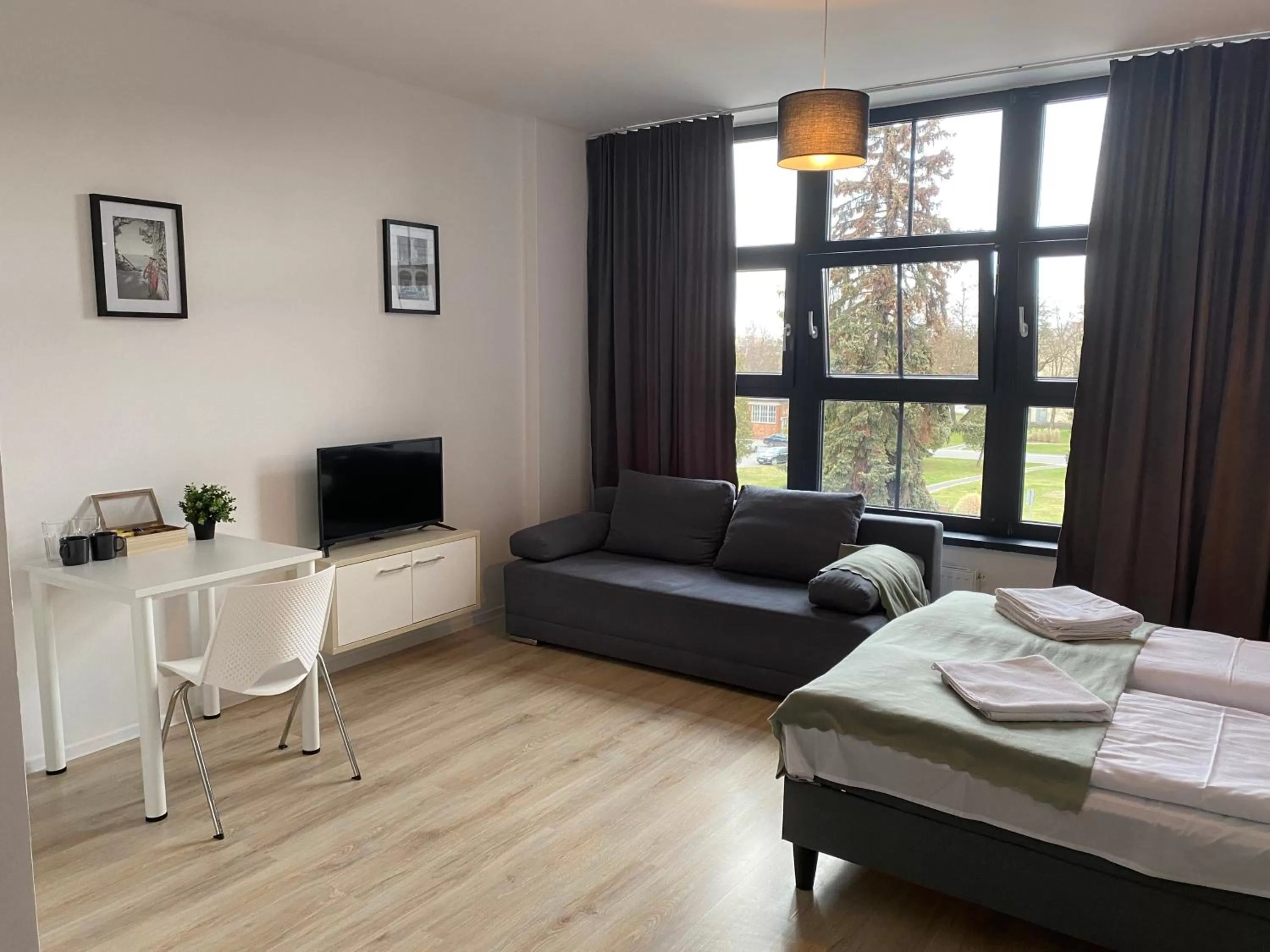 Bed in SleepWell Apartments